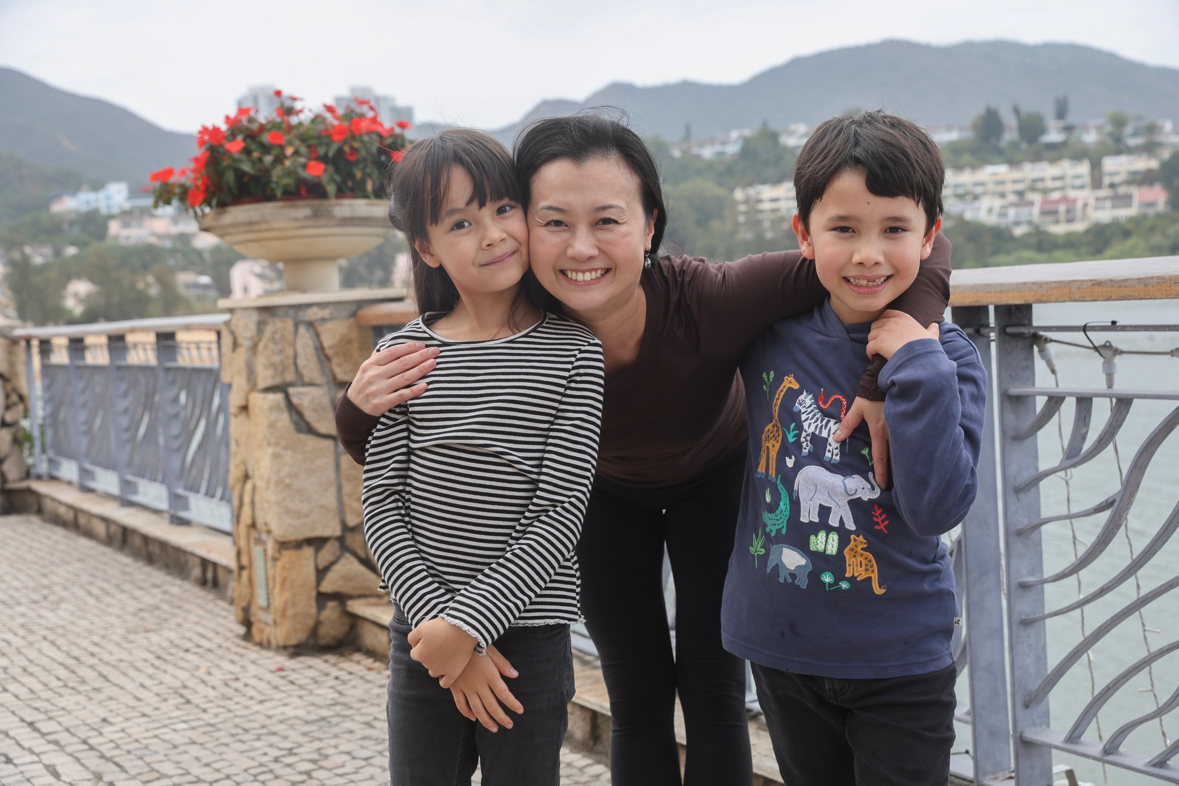 Anri Shiga, a working mum in Hong Kong, with her children. She and others describe the challenges of balancing childcare and career. Photo: Edmond So