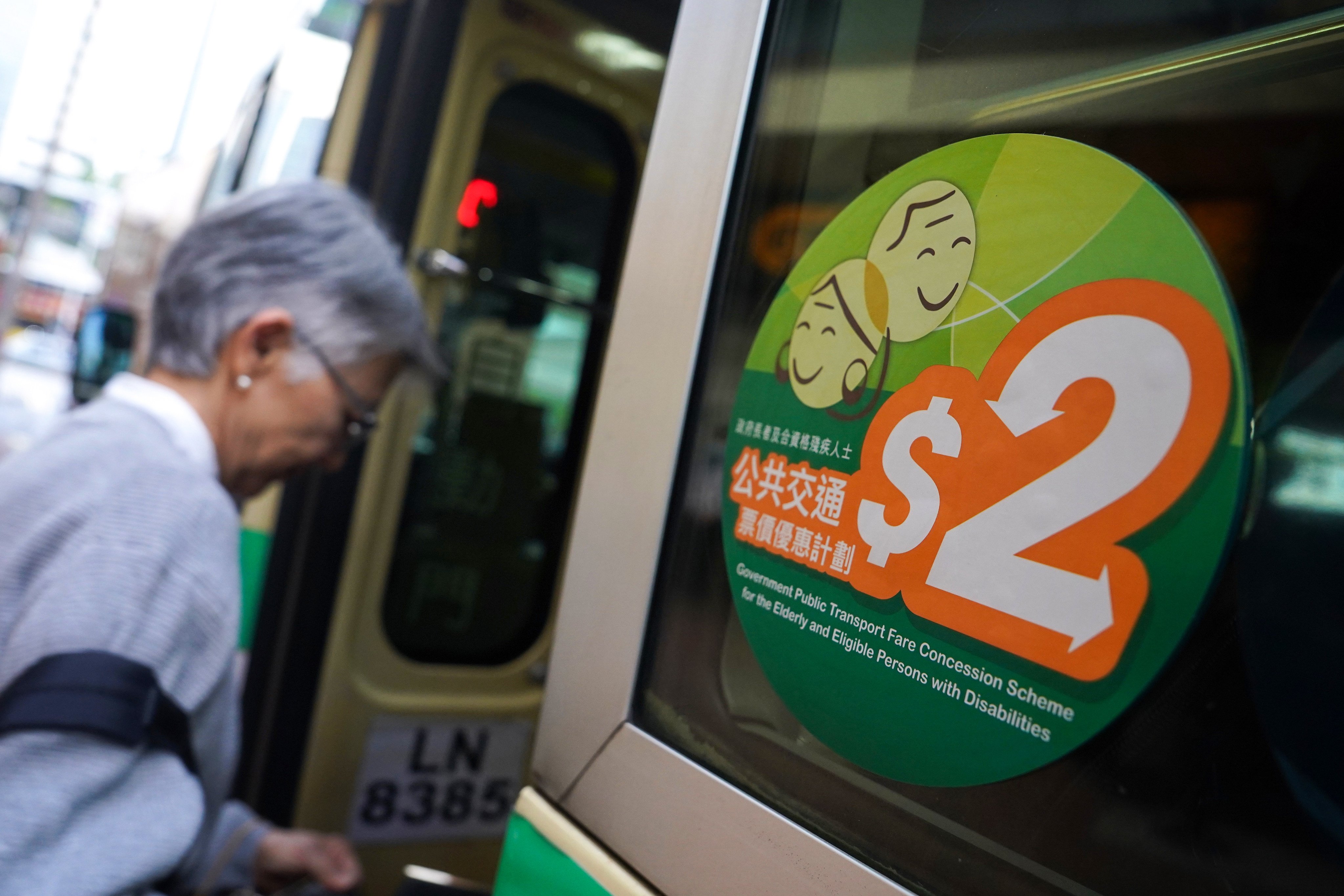 A sticker advertising the HK$2 fare scheme for the elderly and disabled is shown on a minibus on February 21. The plan implemented in 2012 was imaginative and socially significant, but the 2022 expansion of the scheme was a mistake. Photo: Elson Li