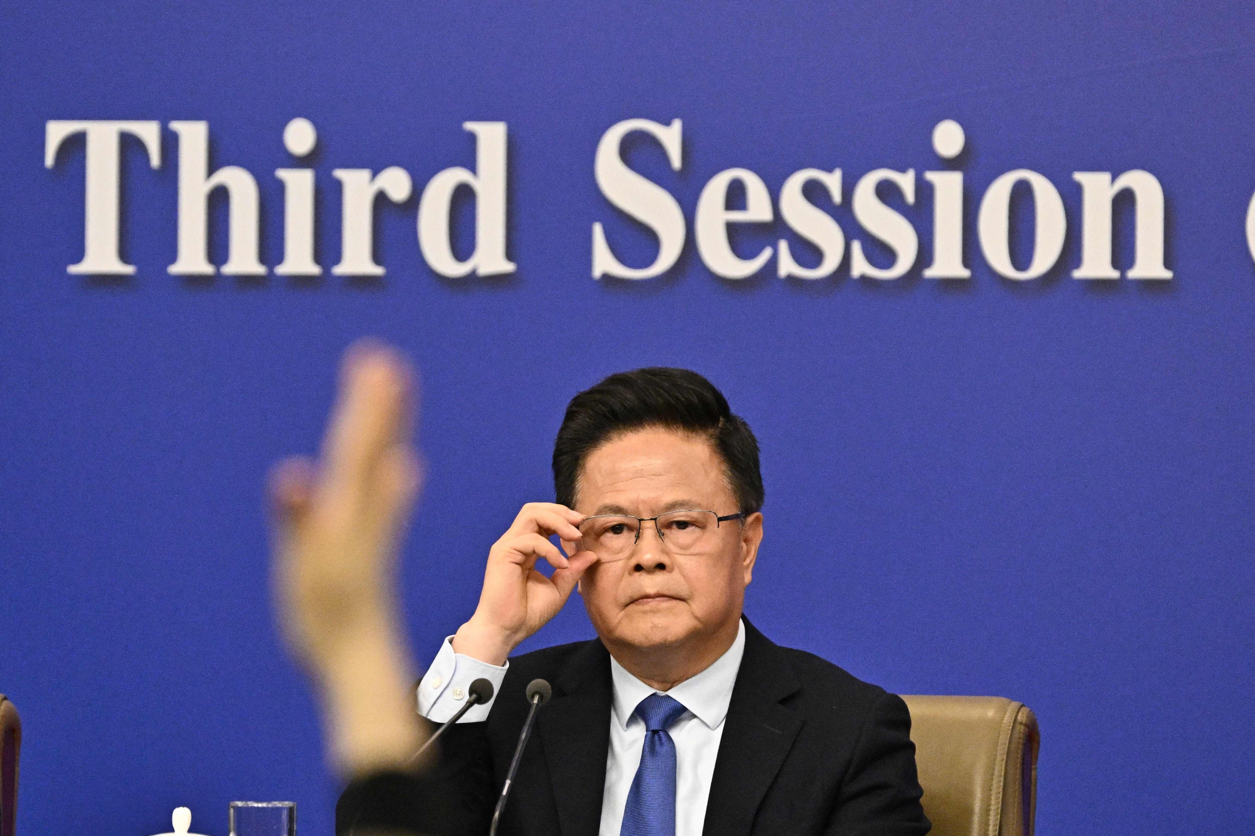 A journalist raises his hand to ask National Development and Reform Commission  chairman Zheng Shanjie a question at a news conference in Beijing on Thursday focused on China’s economy. Photo: AFP