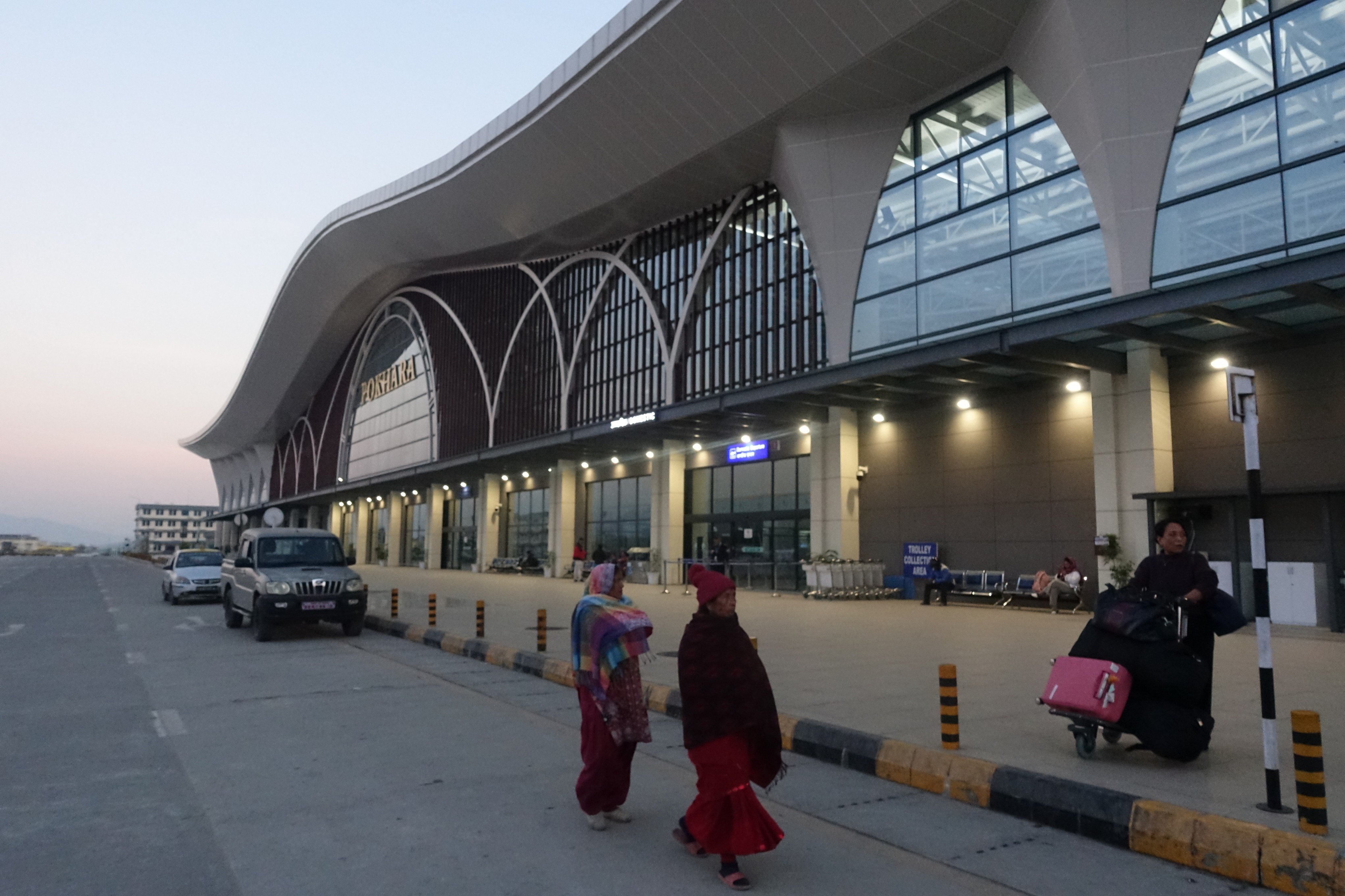 Passengers wait outside Pokhara International Airport in Pokhara, Nepal. Photo: China News Service via Getty Images