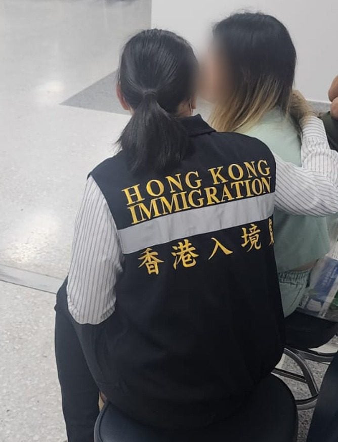 A task force member (left) with one of the rescued Hong Kong residents. Photo: Handout