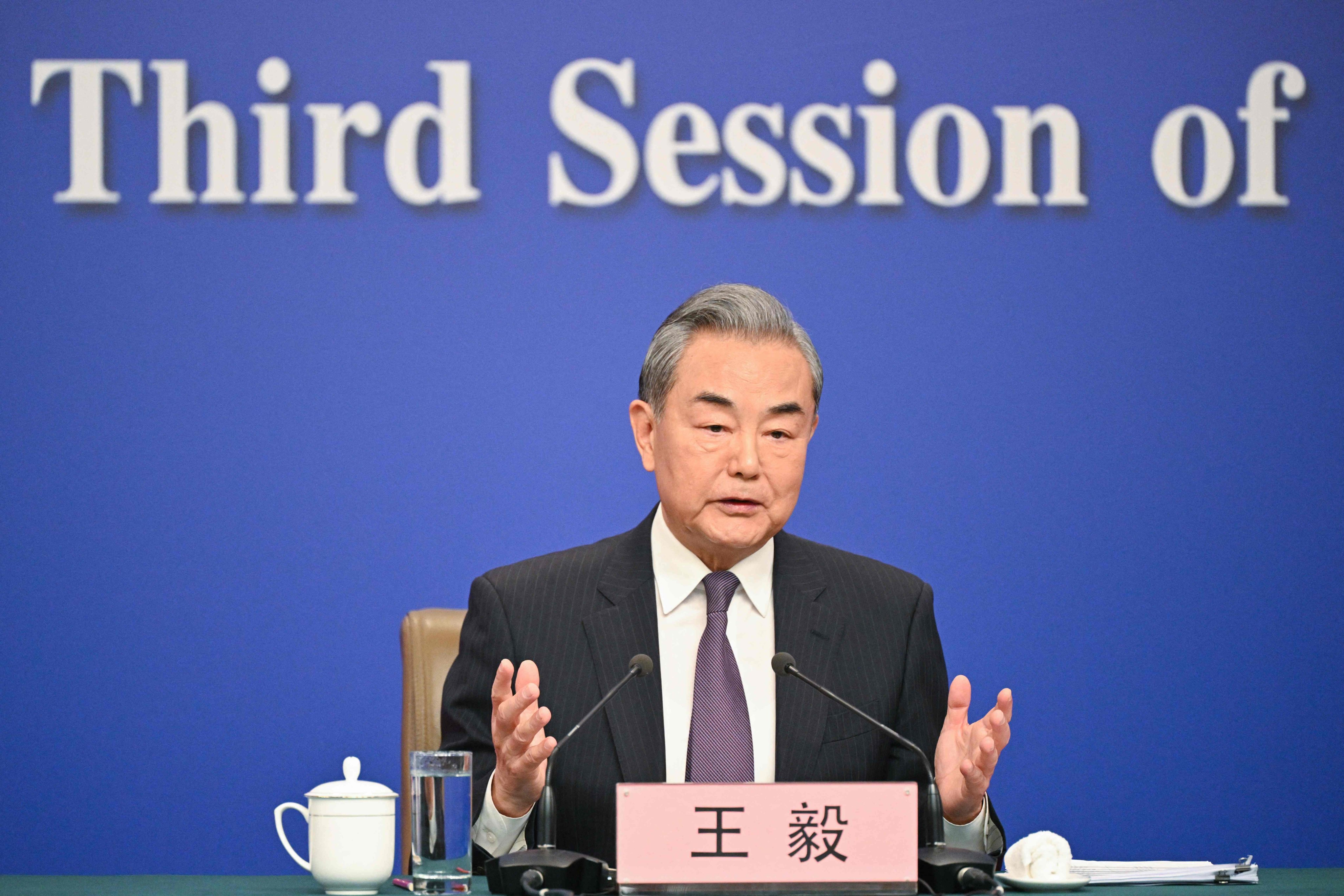 China’s Foreign Minister Wang Yi facing the press. Photo: AFP