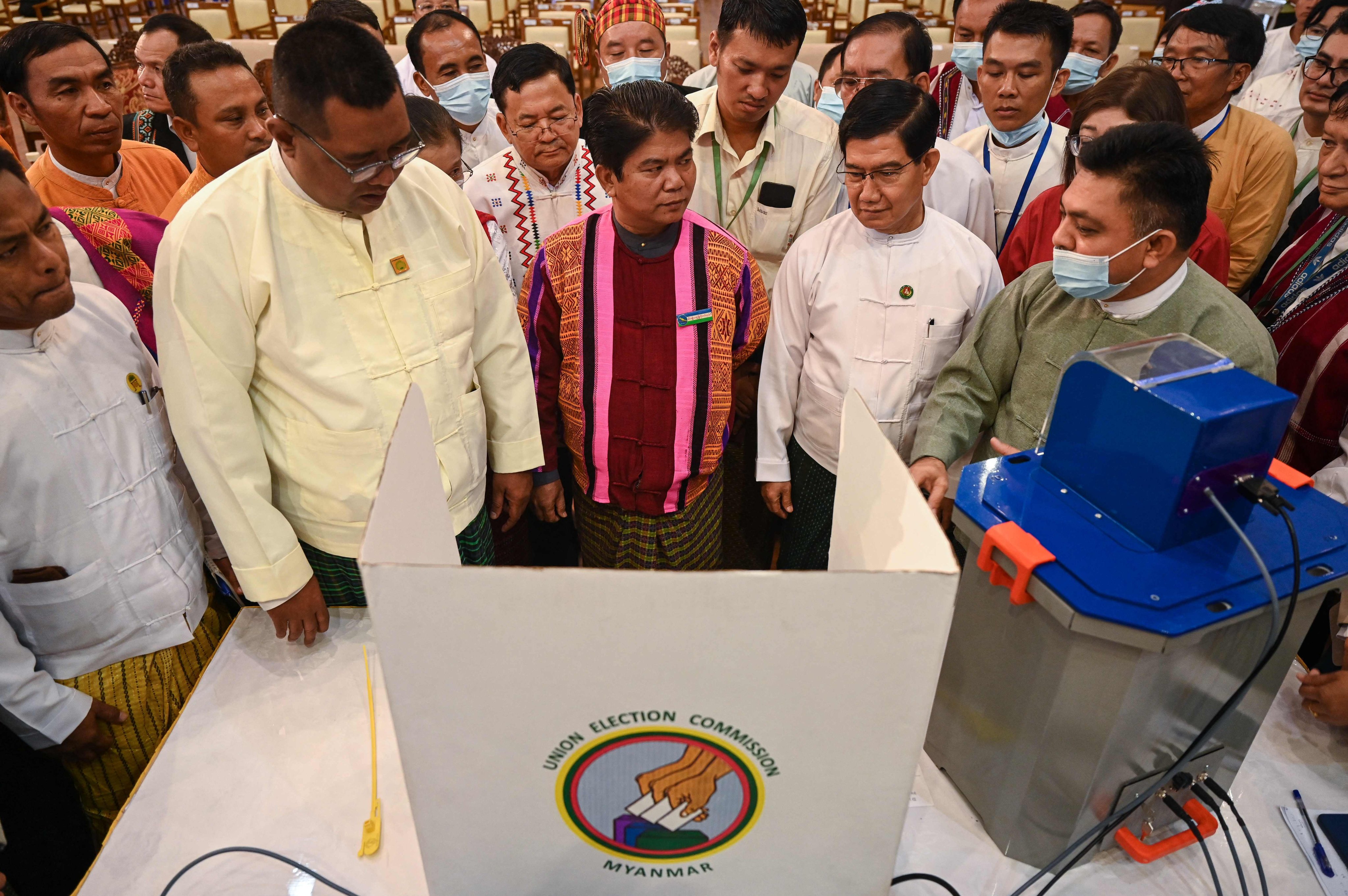 Members of Myanmar’s Union Election Commission during a demonstration of voting machines to be used in future elections in Myanmar, in Yangon, Myanmar, in 2023. Photo: AFP