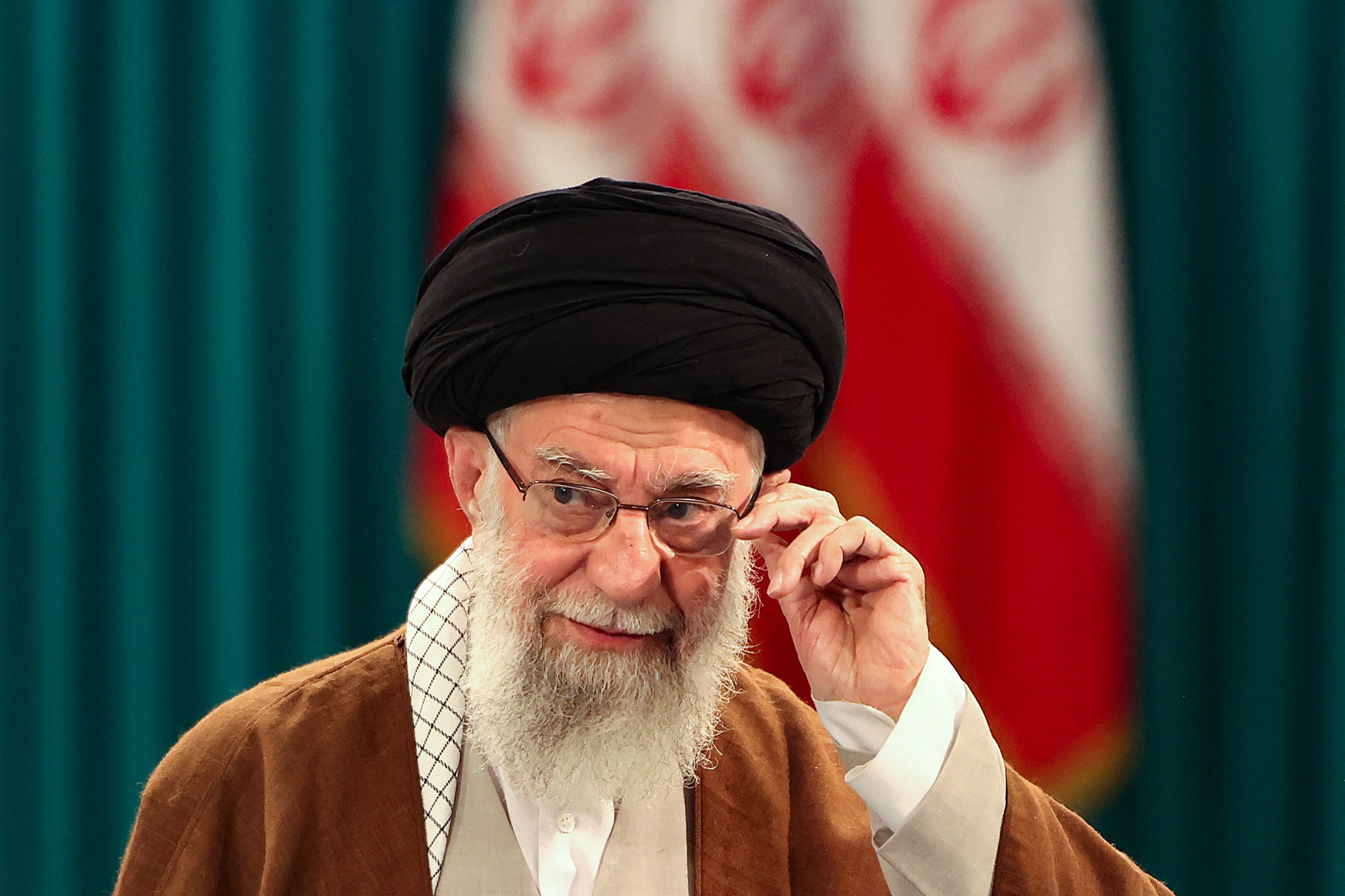 Iran’s Supreme Leader Ayatollah Ali Khamenei adjusts his eyeglasses during a news conference in Tehran in May. Photo: AFP/TNS