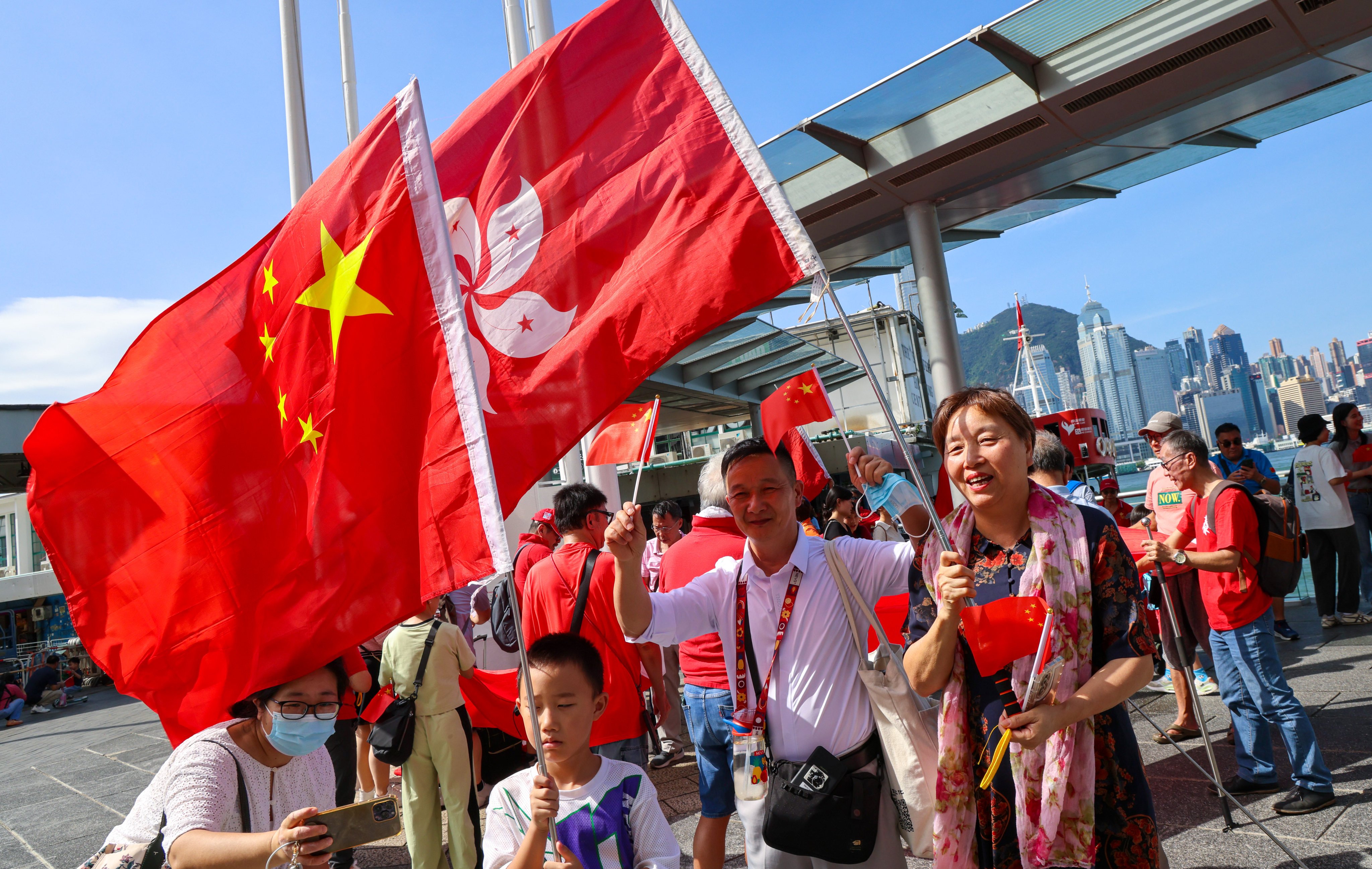 People celebrate National Day at the Tsim Sha Tsui waterfront. Hong Kong has been urged to further develop itself to benefit the rest of the nation. Photo: Jelly Tse