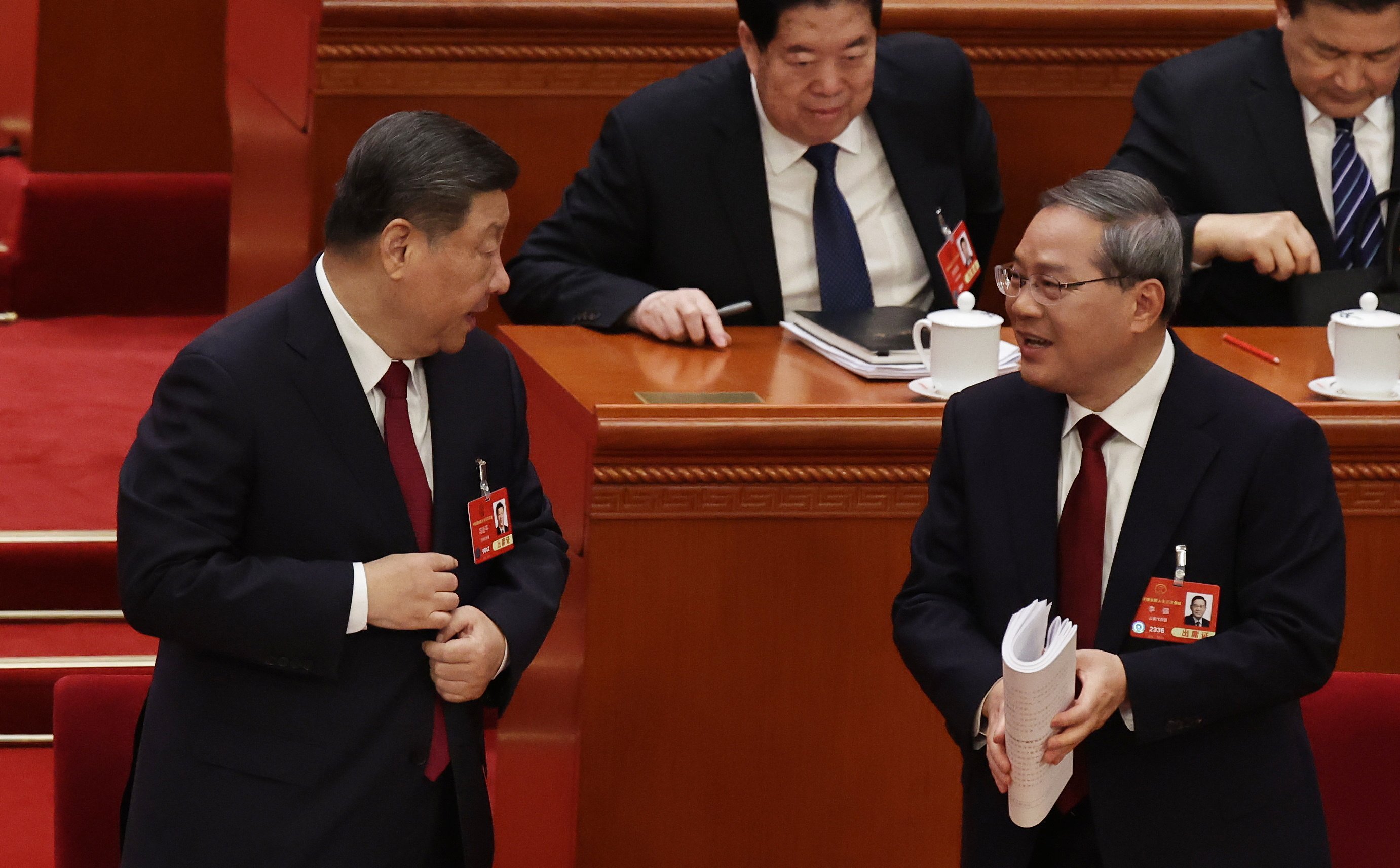 Chinese President Xi Jinping speaks to Premier Li Qiang at the opening ceremony of the third session of the 14th National People’s Congress, at the Great Hall of the People in Beijing, on March 5. Photo: EPA-EFE