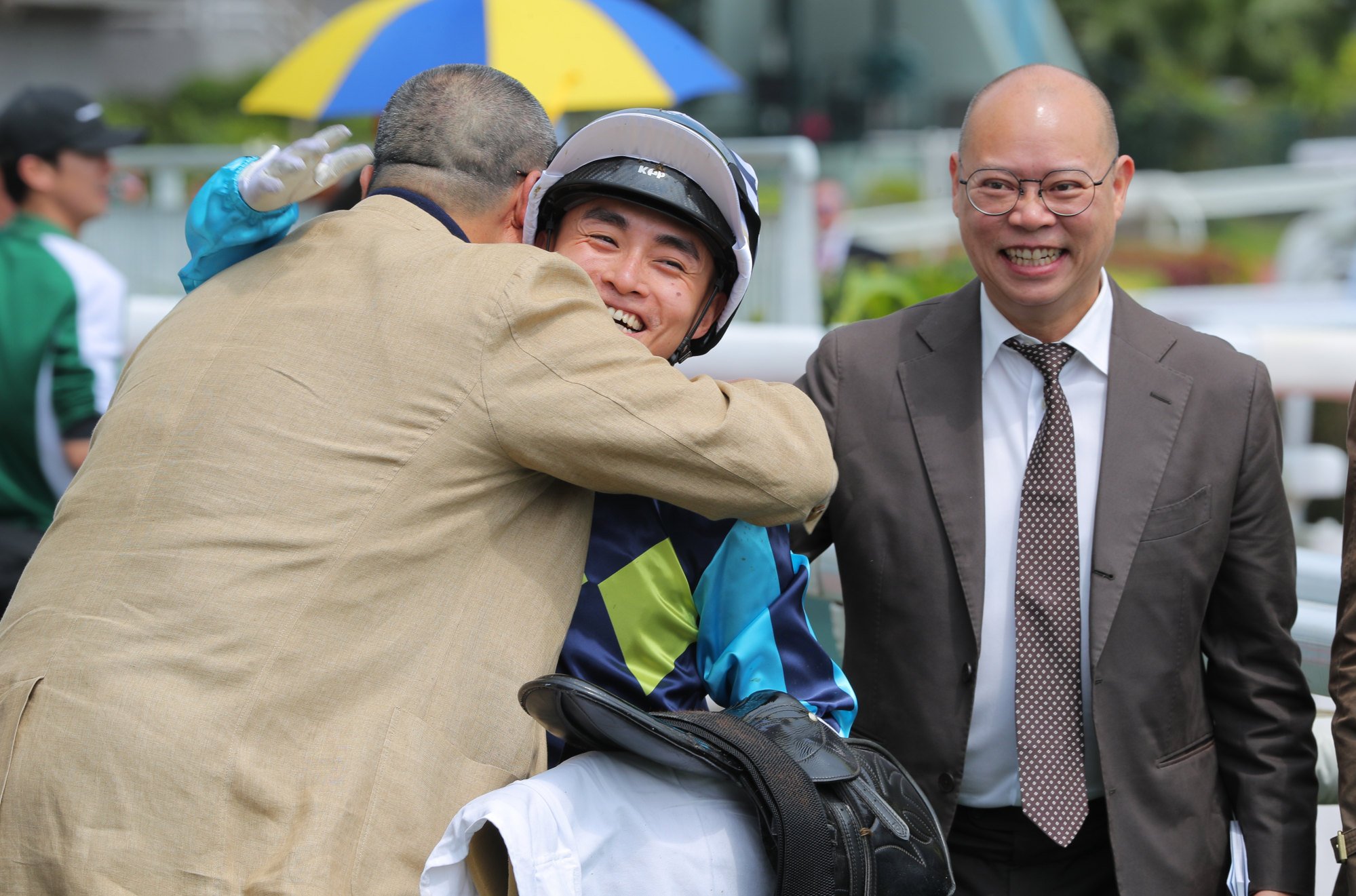 Jockey Keith Yeung celebrates Mount Everest’s win with owner Kendrick Wong and trainer Chris So (right).