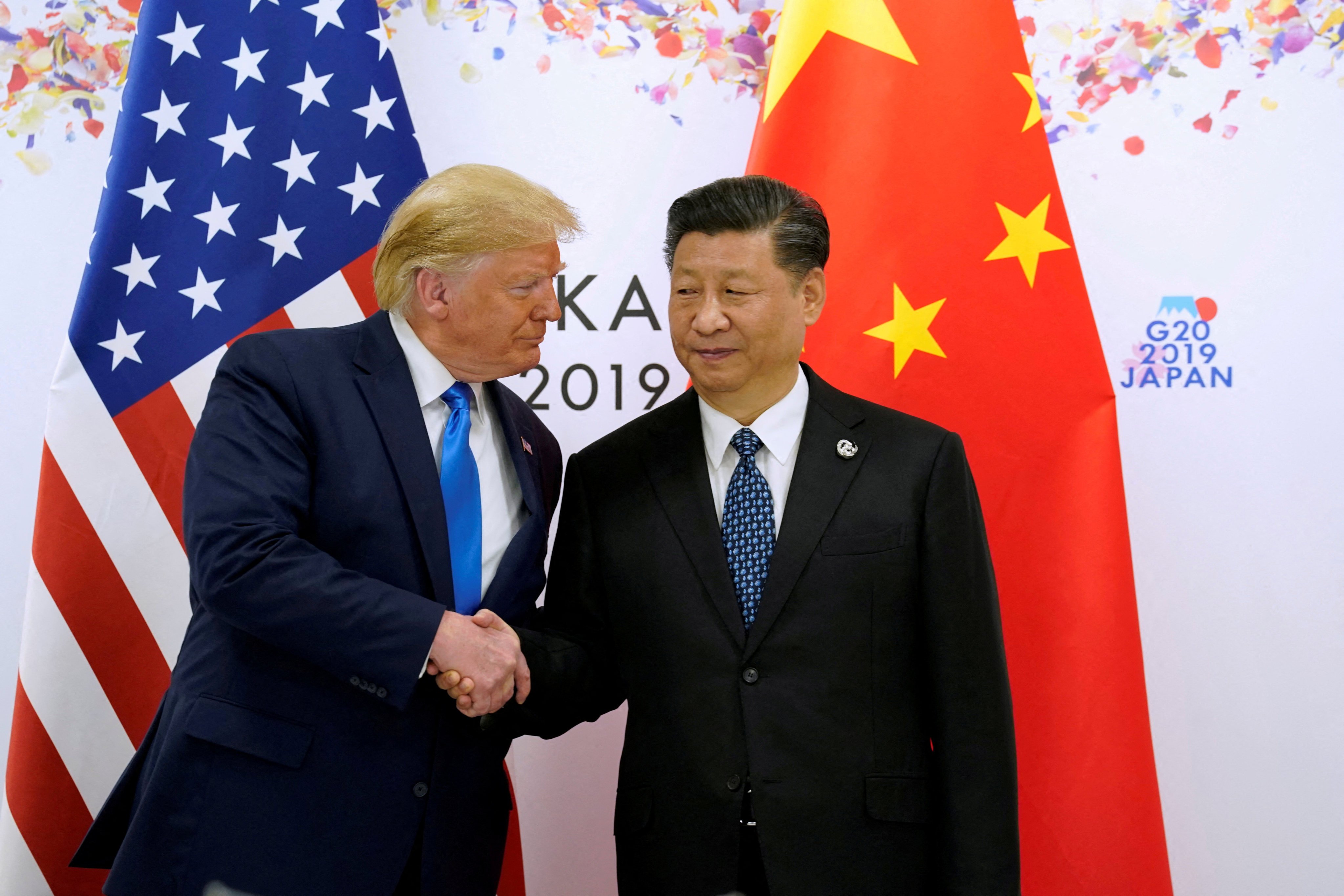 US President Donald Trump and China’s President Xi Jinping shake hands ahead of their bilateral meeting during the G20 leaders summit in Osaka, Japan in June 2019. Photo: Reuters