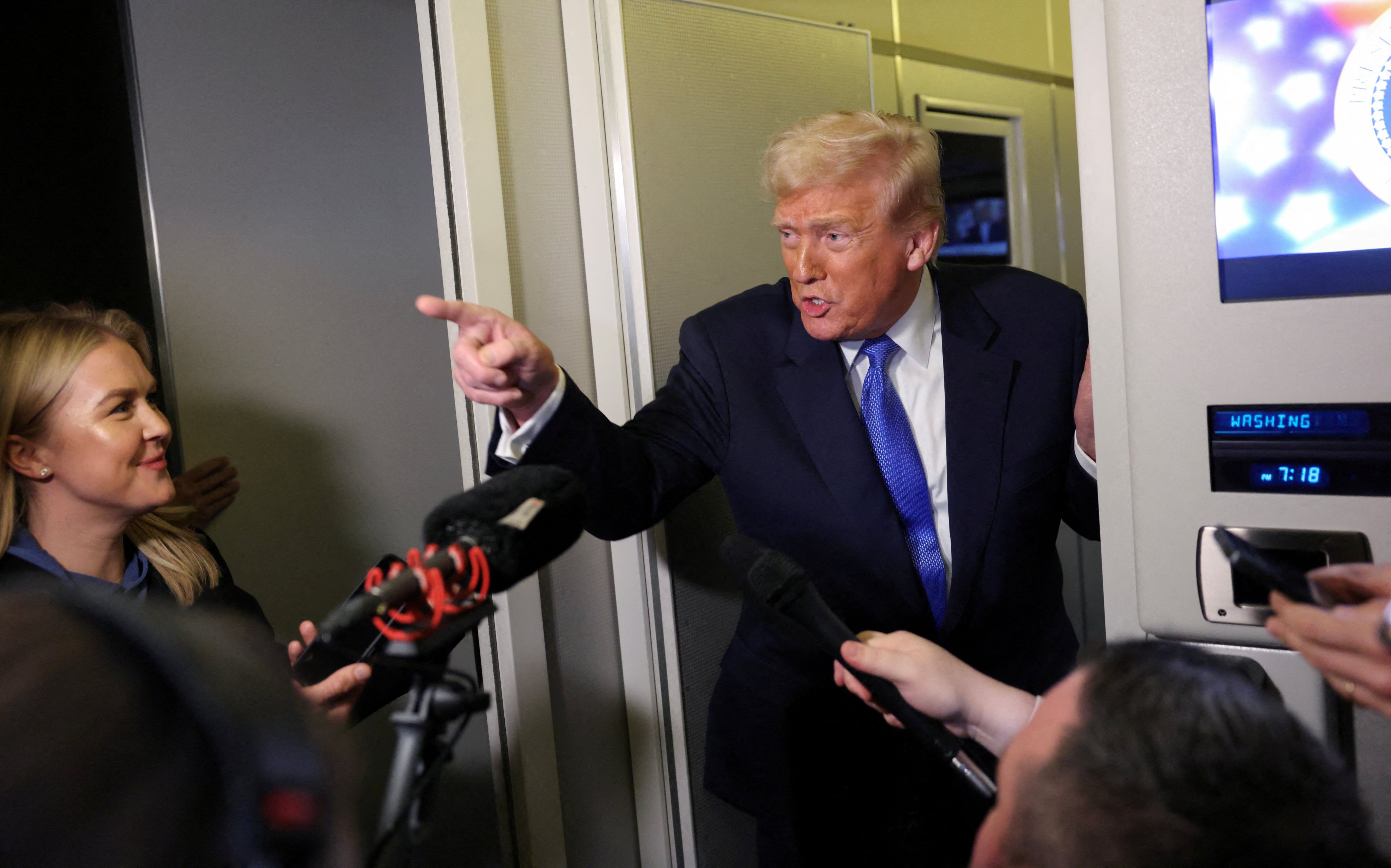 US President Donald Trump speaks to reporters aboard Air Force One. Photo: Reuters