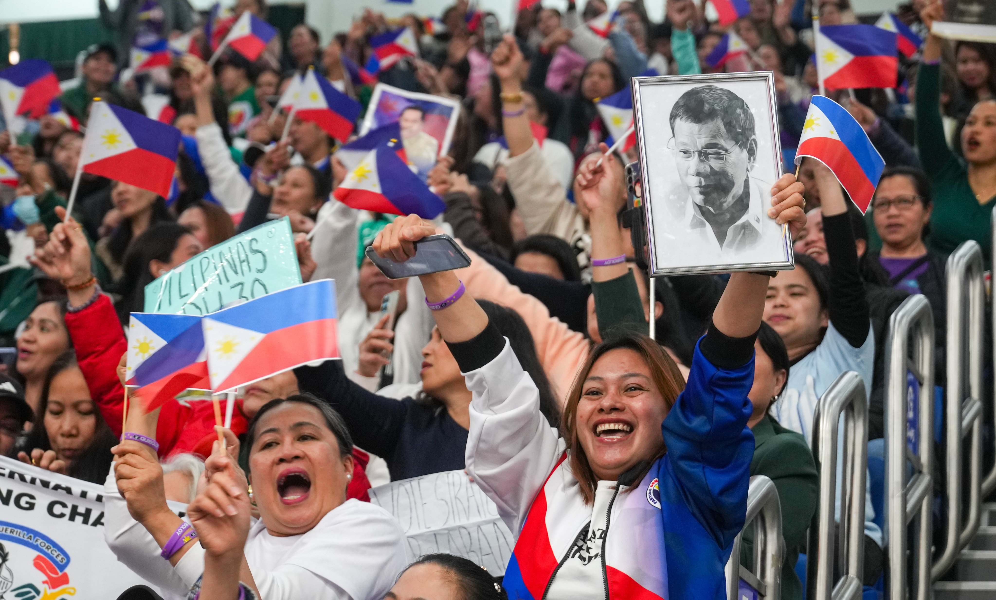 The ex-Philippine president delivered an emotionally charged speech at Southorn Stadium in Wan Chai on Sunday at the event for Filipino workers. Photo: Sam Tsang