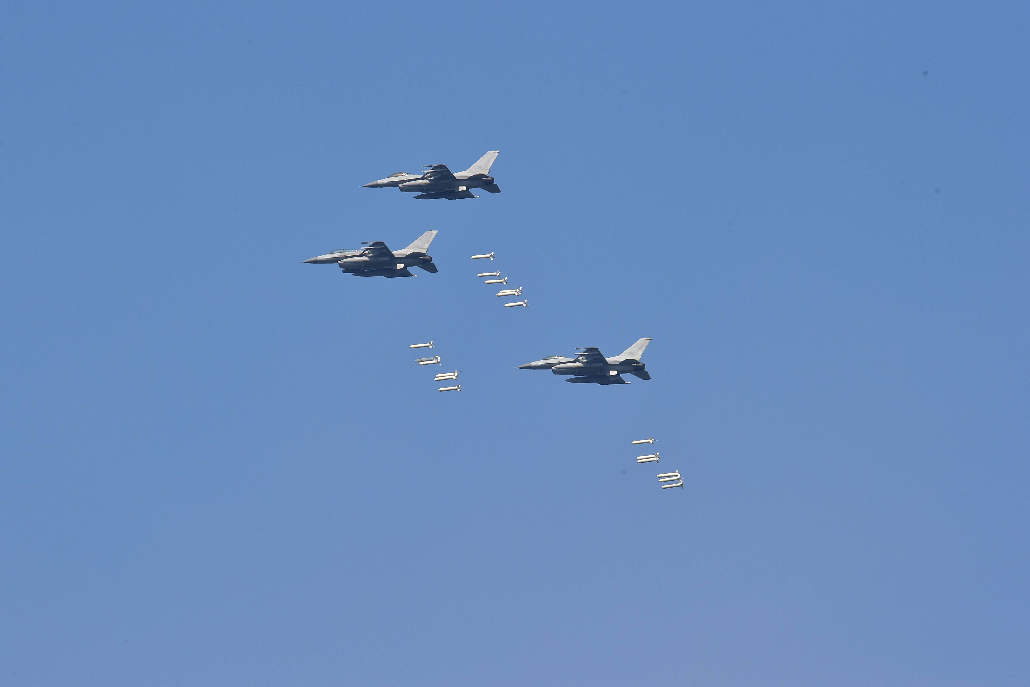 South Korean fighter jets drop bombs on a mountain target during a joint live-firing drill between South Korea and the US. Photo: AFP