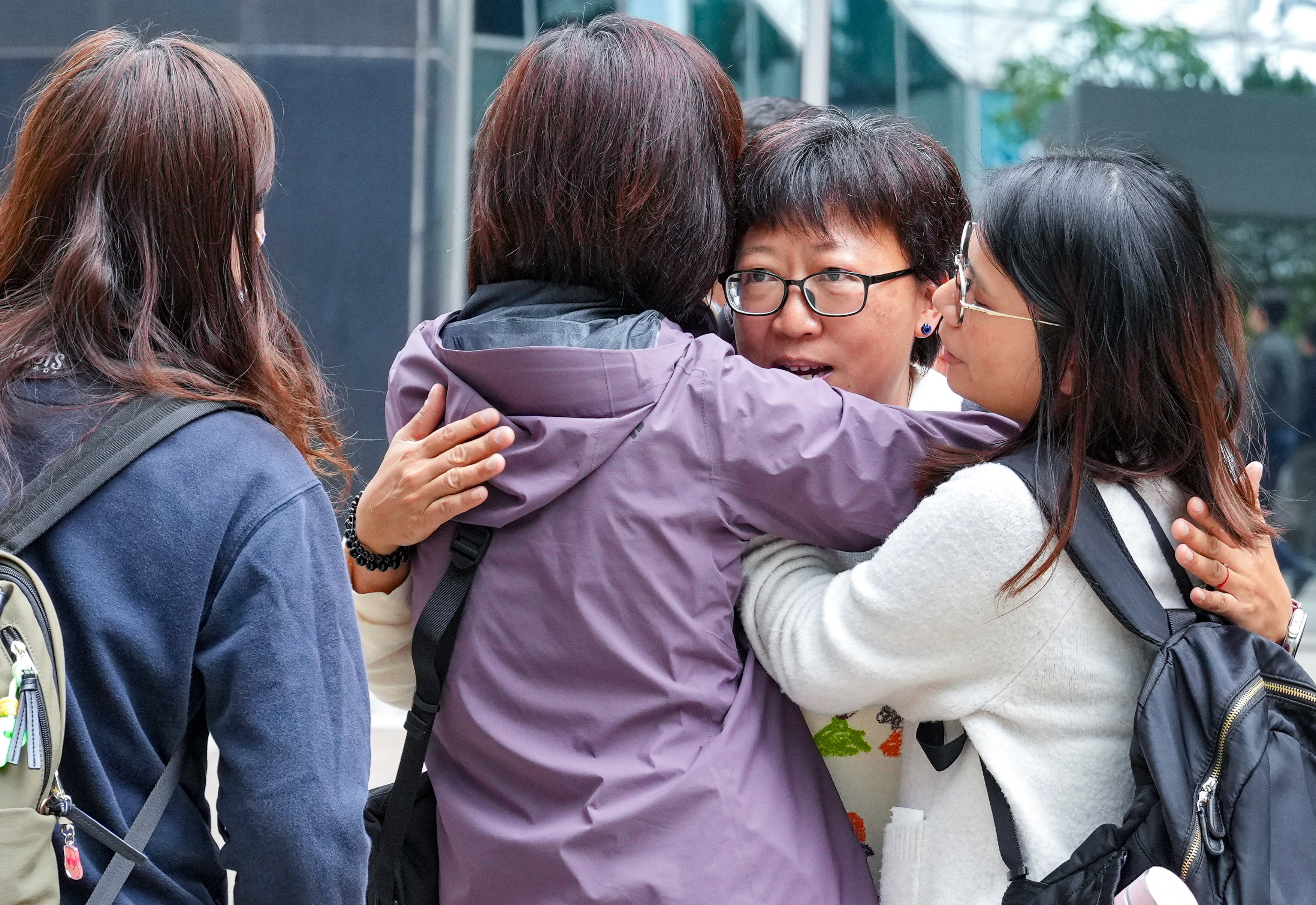 Social worker Jackie Chen arrives at the Hong Kong District Court to hear the verdict on her retrial, and is greeted by supporters. Photo: May Tse