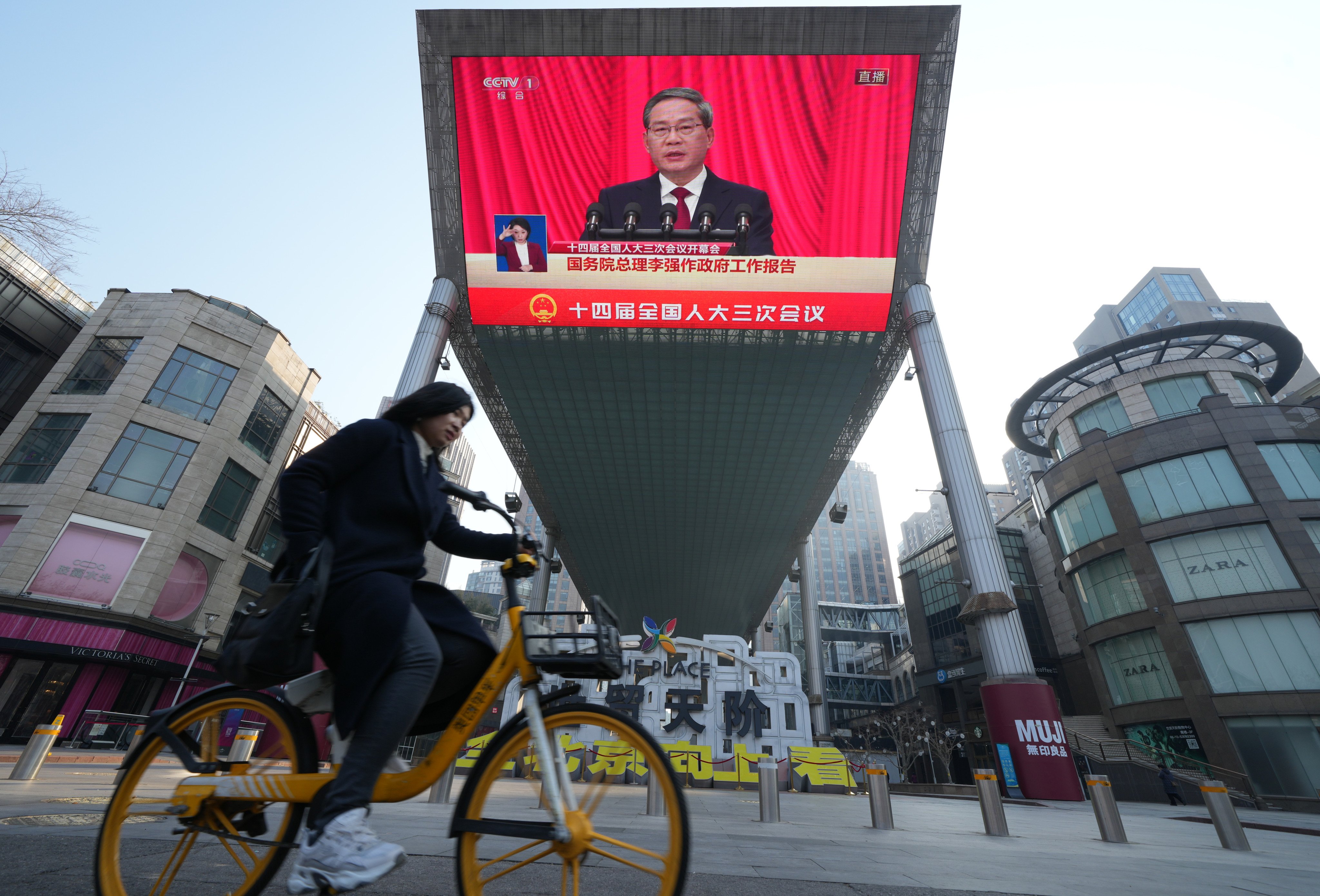 A screen at a shopping centre in Beijing shows Premier Li Qiang speaking during the opening of the annual session of China’s top legislature on Wednesday. Photo: Robert Ng