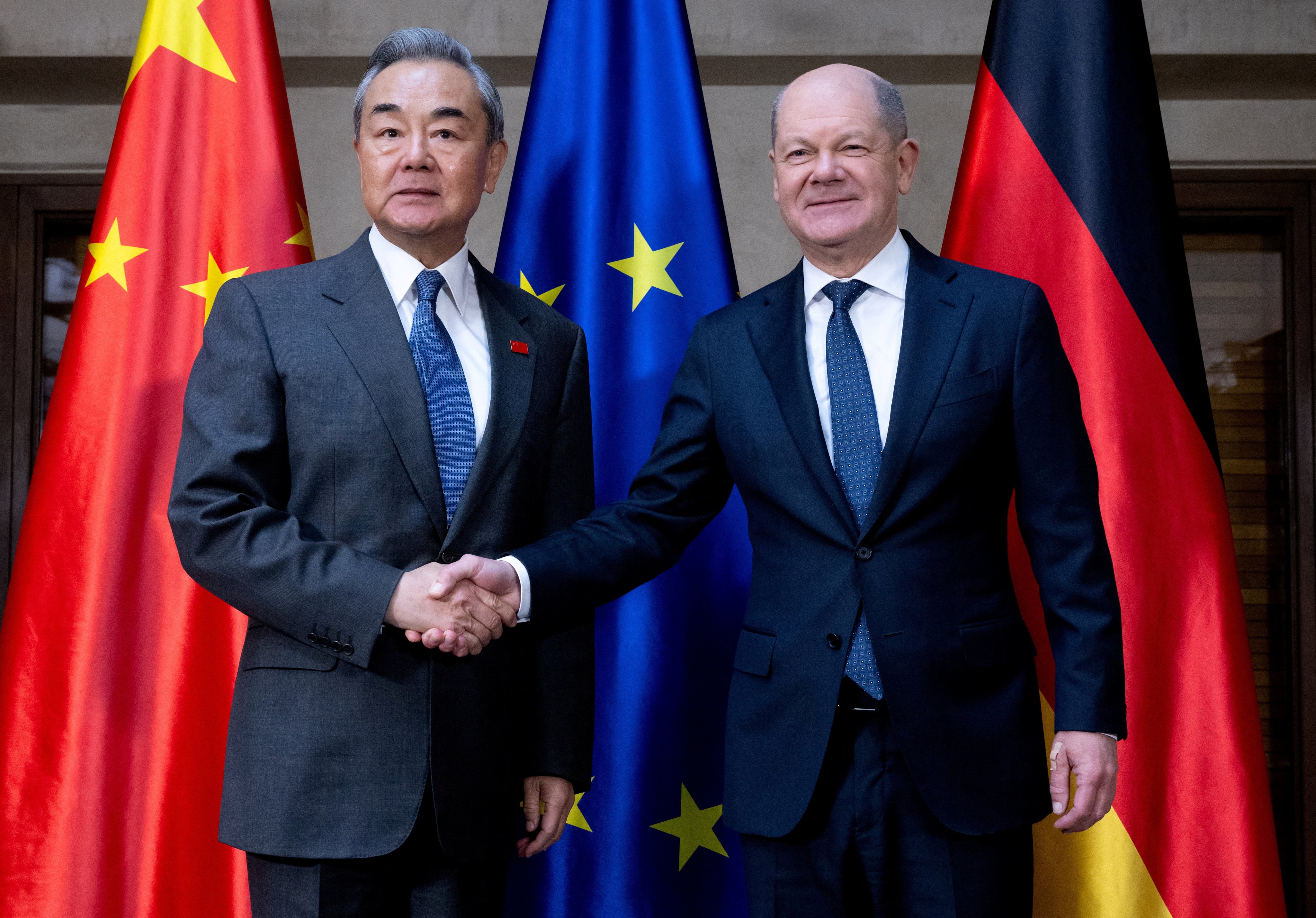 German Chancellor Olaf Scholz, right, and Foreign Minister Wang Yi shake hands at the Munich Security Conference in Munich, Germany, on February 15. Photo: Reuters