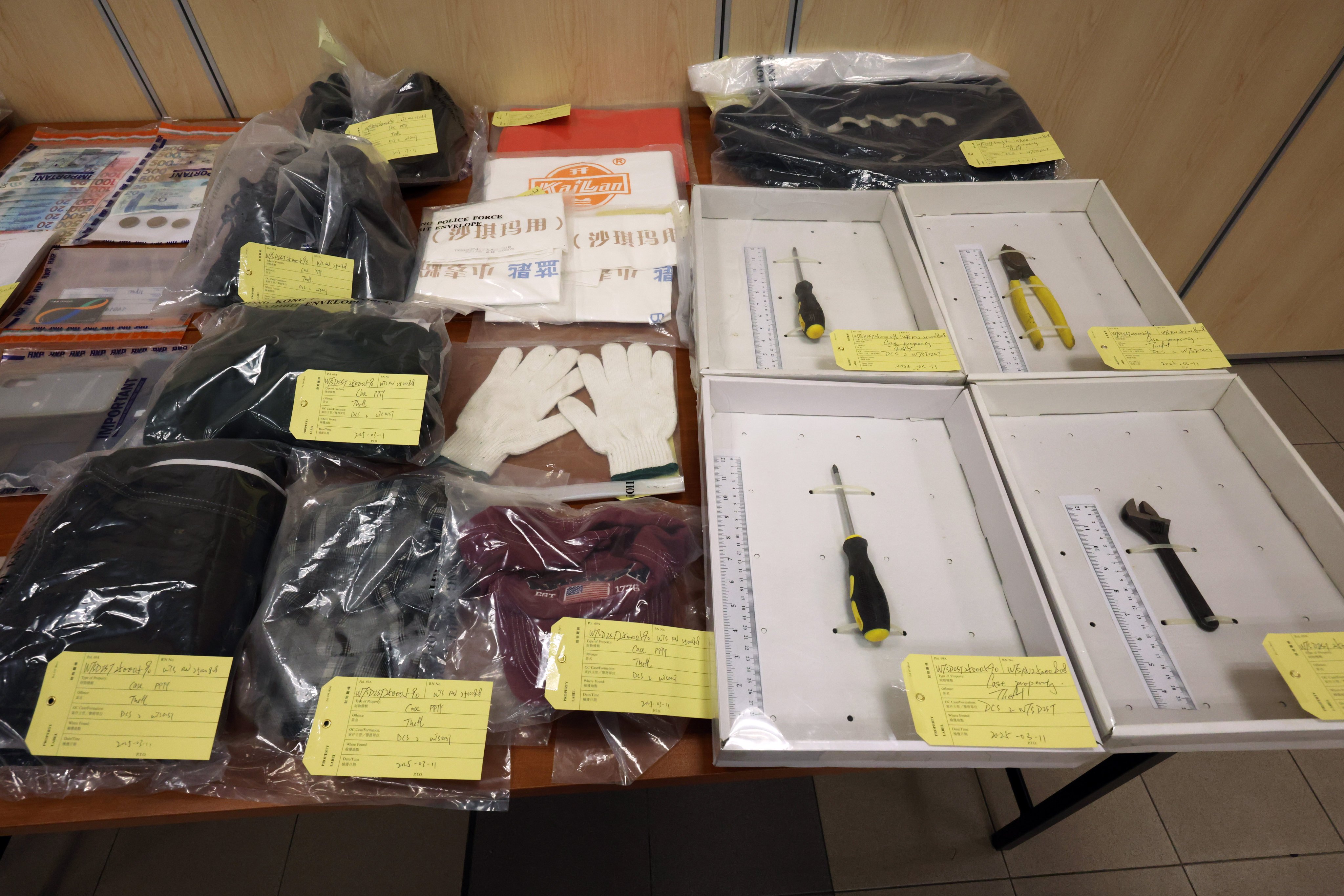 Police display evidence seized in the case including tools allegedly used to steal copper pipes. Photo: Jelly Tse