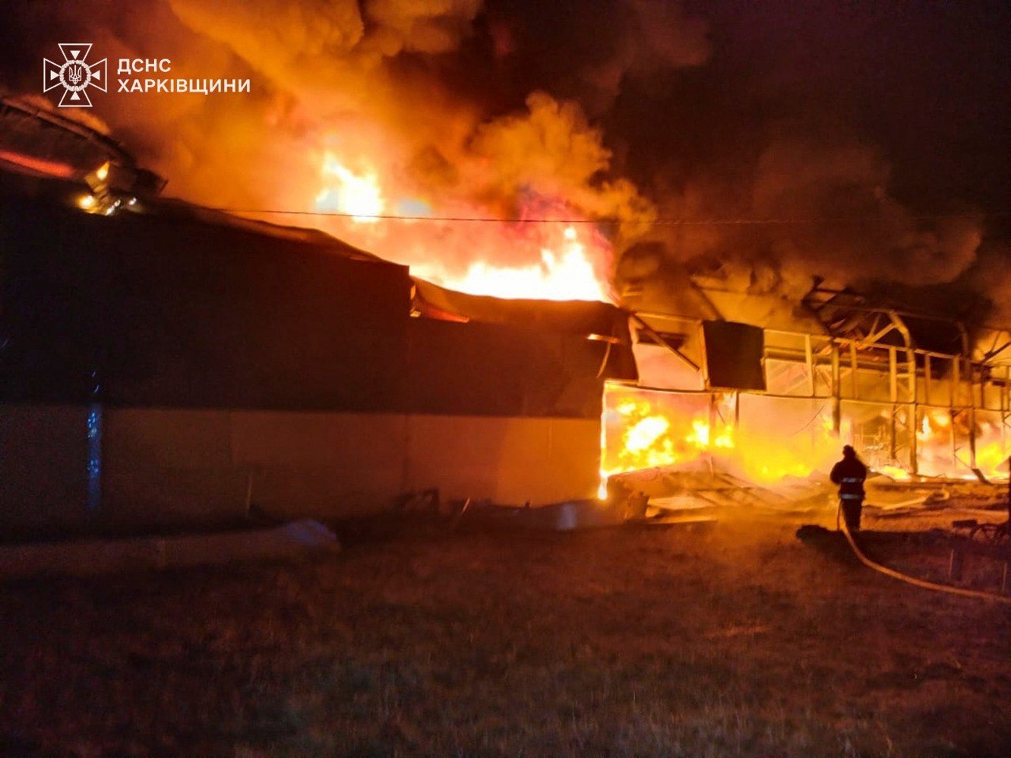 Ukrainian firefighters at a storehouse struck by a Russian attack in Chuhuiv, near Kharkiv, on Monday. Photo: Ukrainian Emergency Service via AP