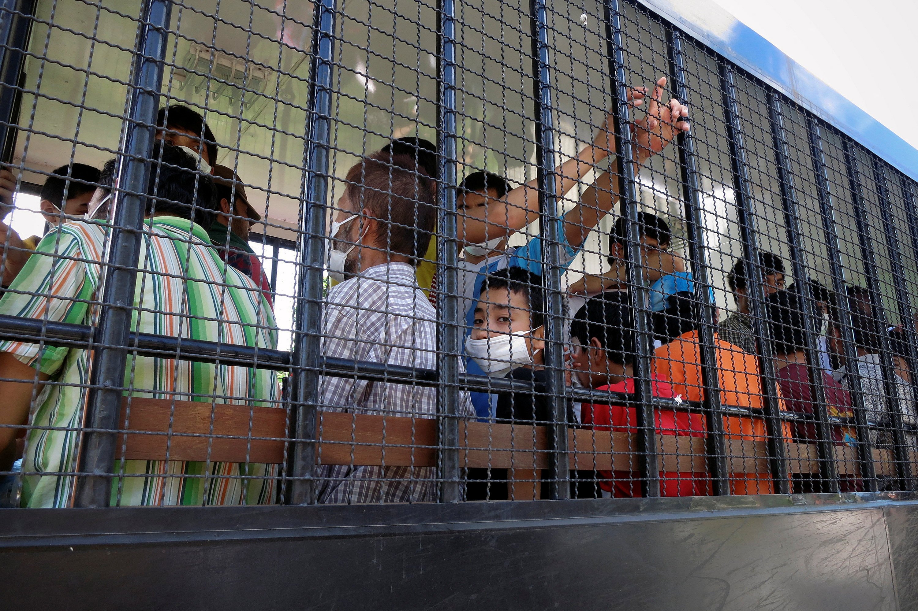 Suspected Uygur detainees are transported to a detention facility in the town of Songkhla, southern Thailand, in 2014. Photo: Reuters