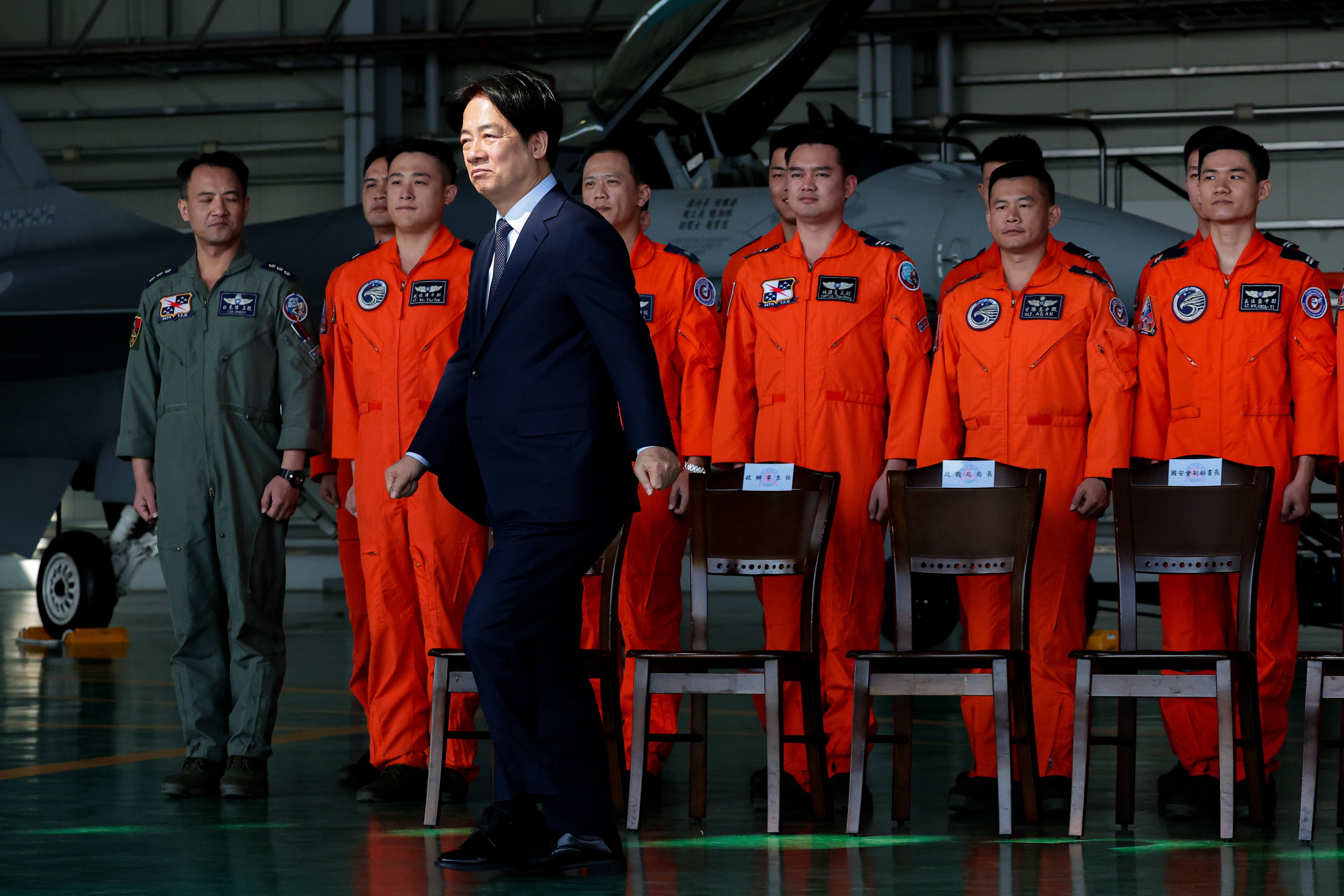 Taiwanese leader William Lai walks past air force pilots during a visit to an airbase in Taitung in January. Photo: EPA-EFE