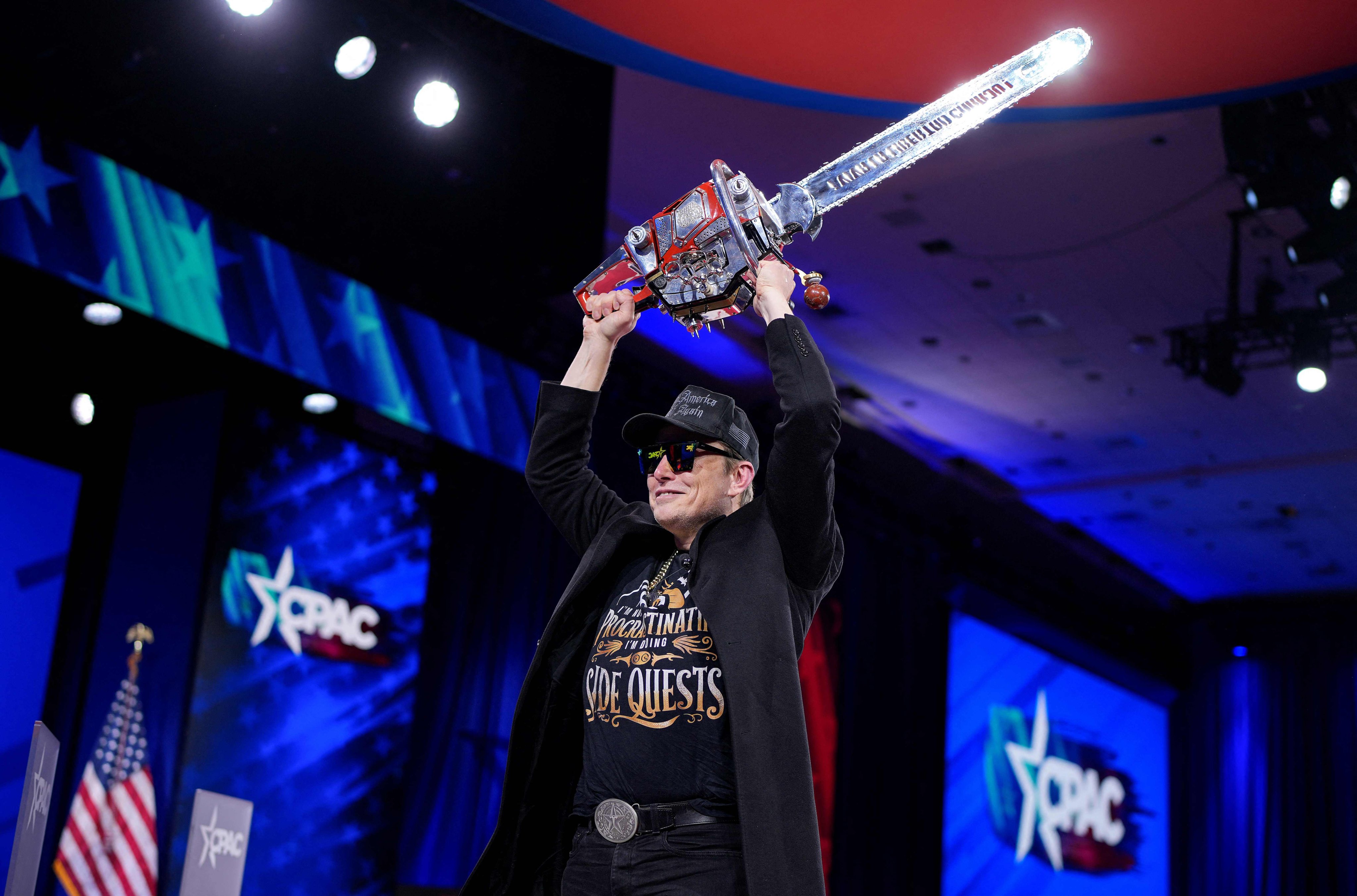 Elon Musk wields a chainsaw on stage at the Conservative Political Action Conference at the Gaylord National Resort Hotel And Convention Centre on February 20 in Oxon Hill, Maryland, US. Photo: Getty Images via AFP