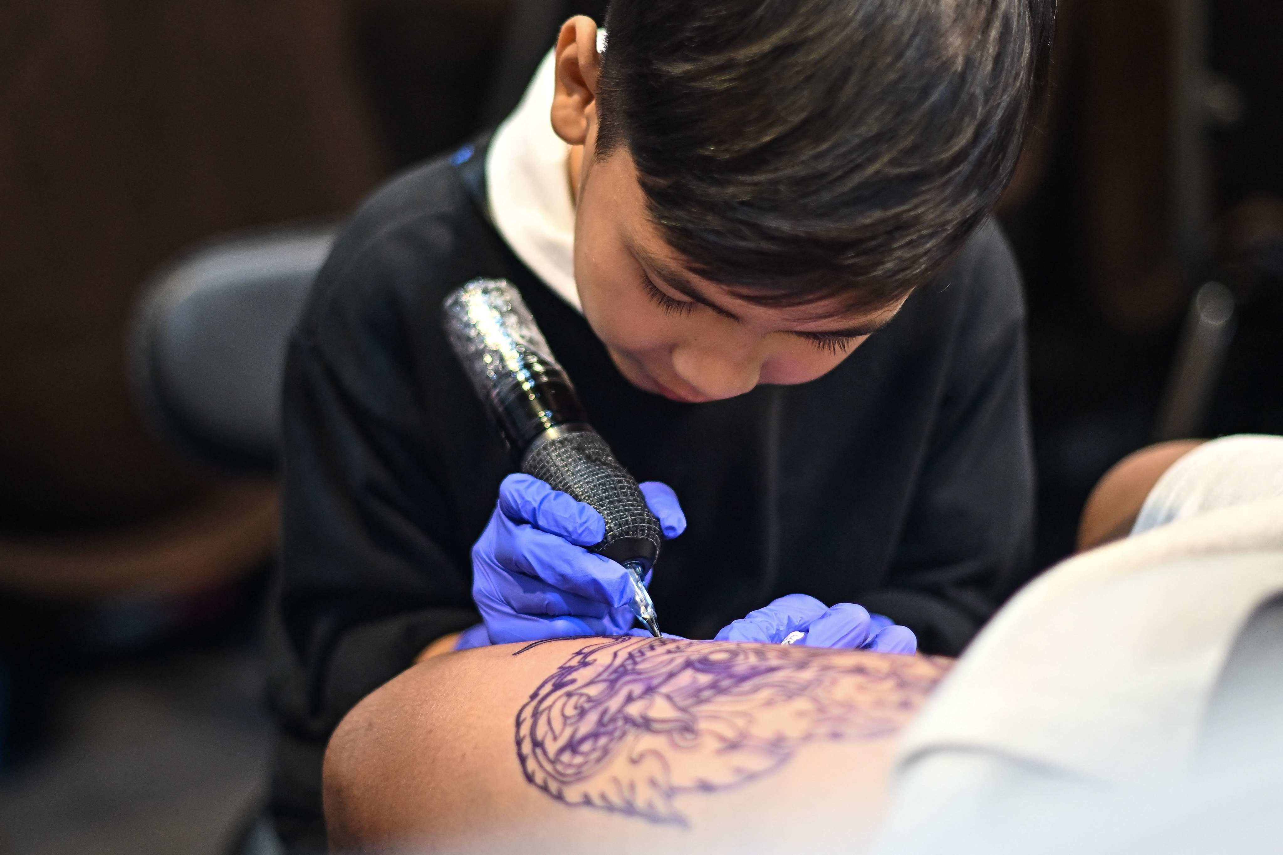 Napat Mitmakorn goes by the nickname “Knight”. Tattooing is a centuries-old tradition in Thailand. Photo: AFP