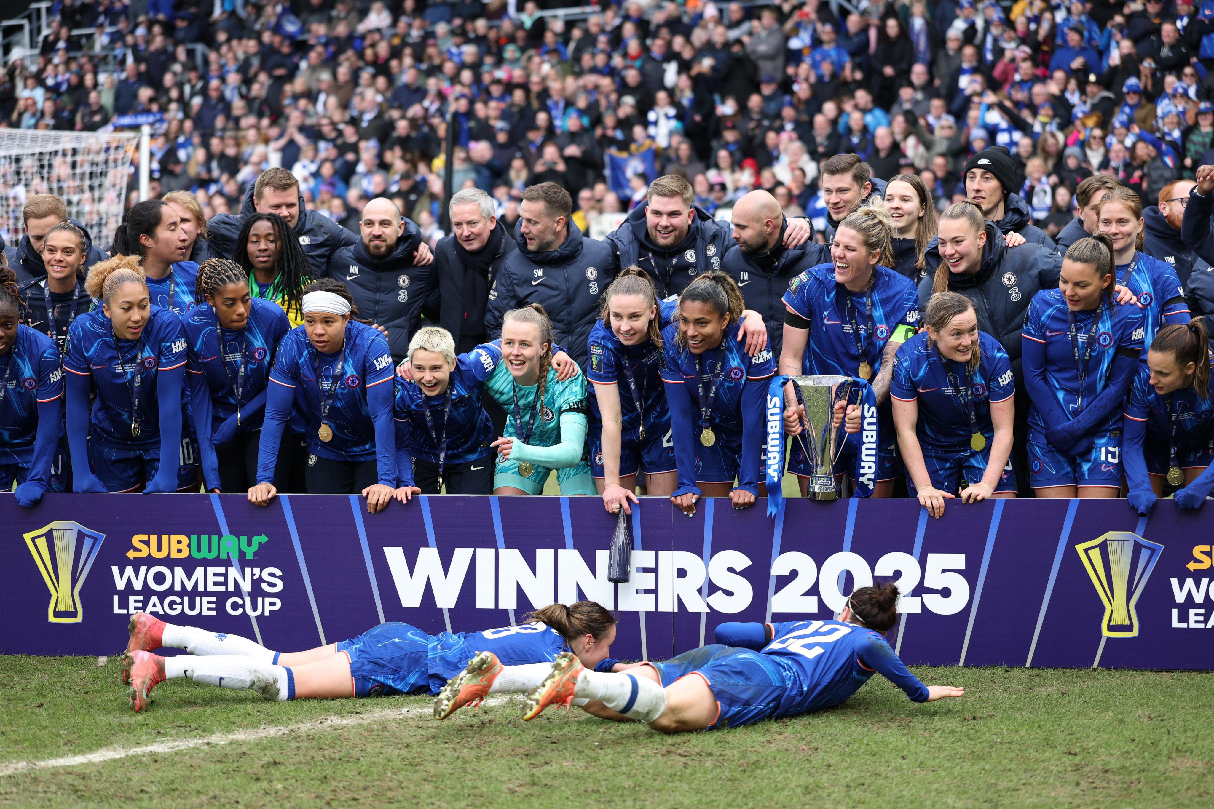 Chelsea’s Lucy Bronze and Wieke Kaptein celebrate with teammates after winning the Women’s League Cup. Photo: Reuters