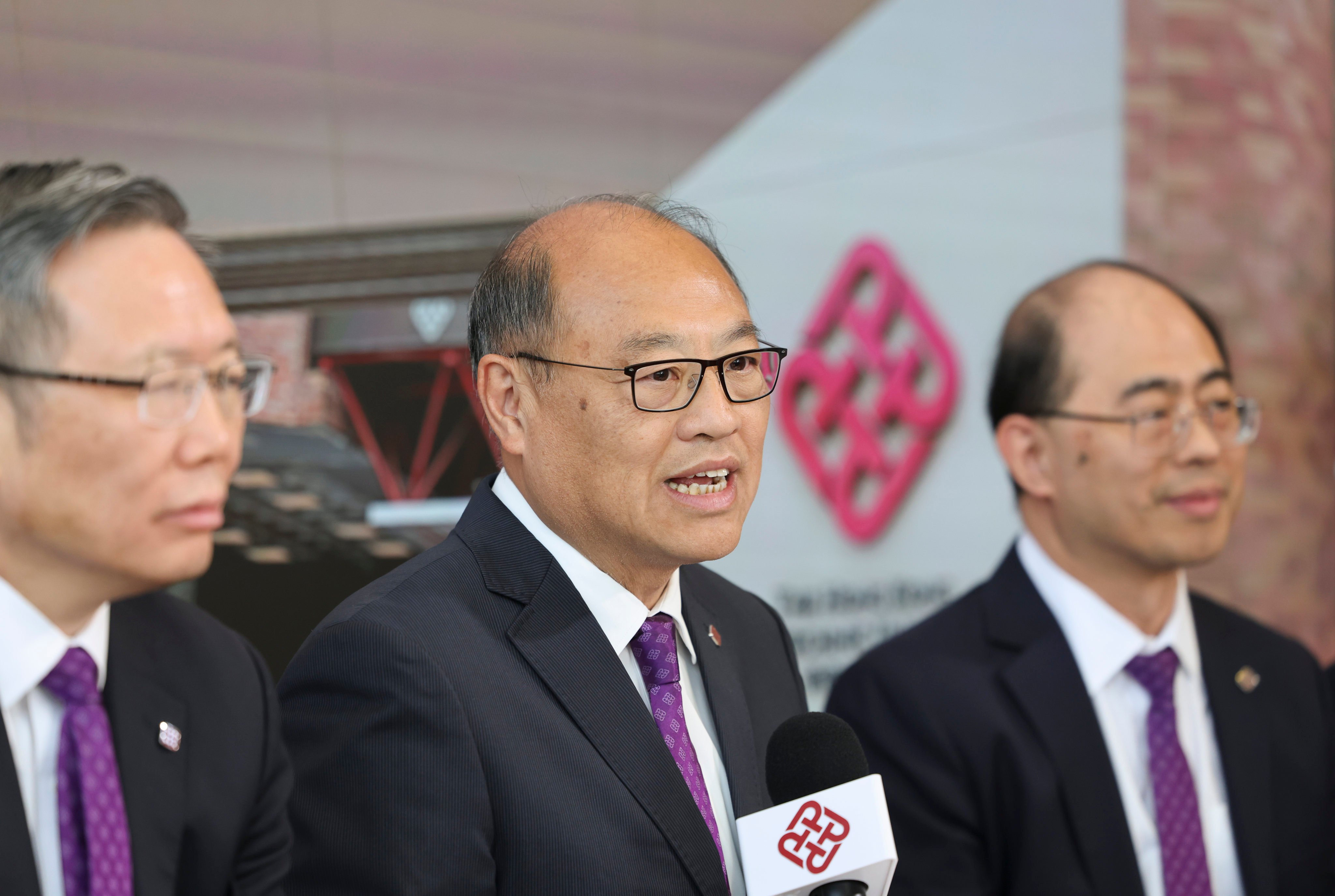 Lam Tai-fai (centre), council chairman, says the school can weather tough times with the government. Photo: Nora Tam