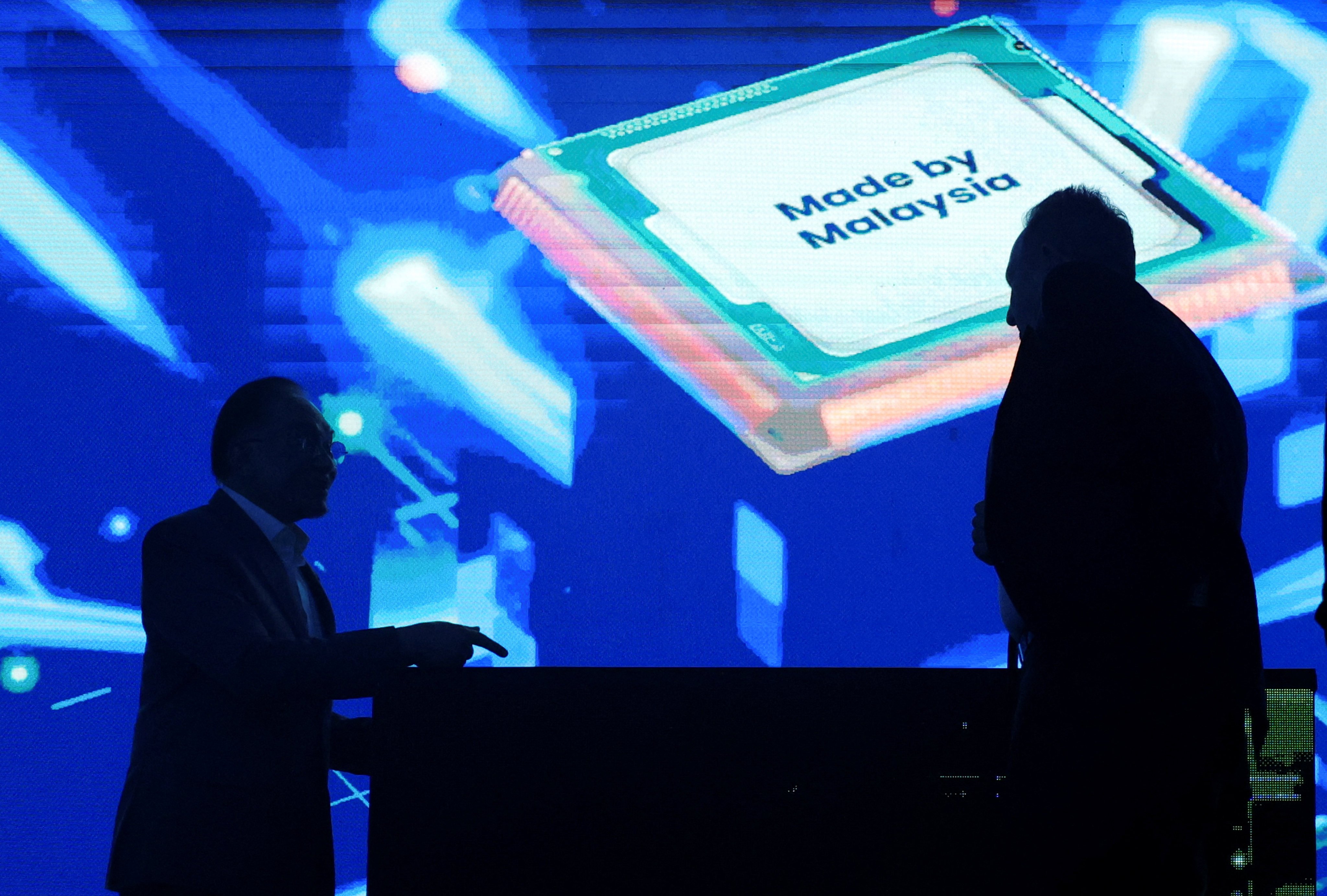 Malaysia’s Prime Minister Anwar Ibrahim (left) speaks to Rene Haas, CEO of Arm Holdings, at an event in Kuala Lumpur on March 5. Photo: Reuters