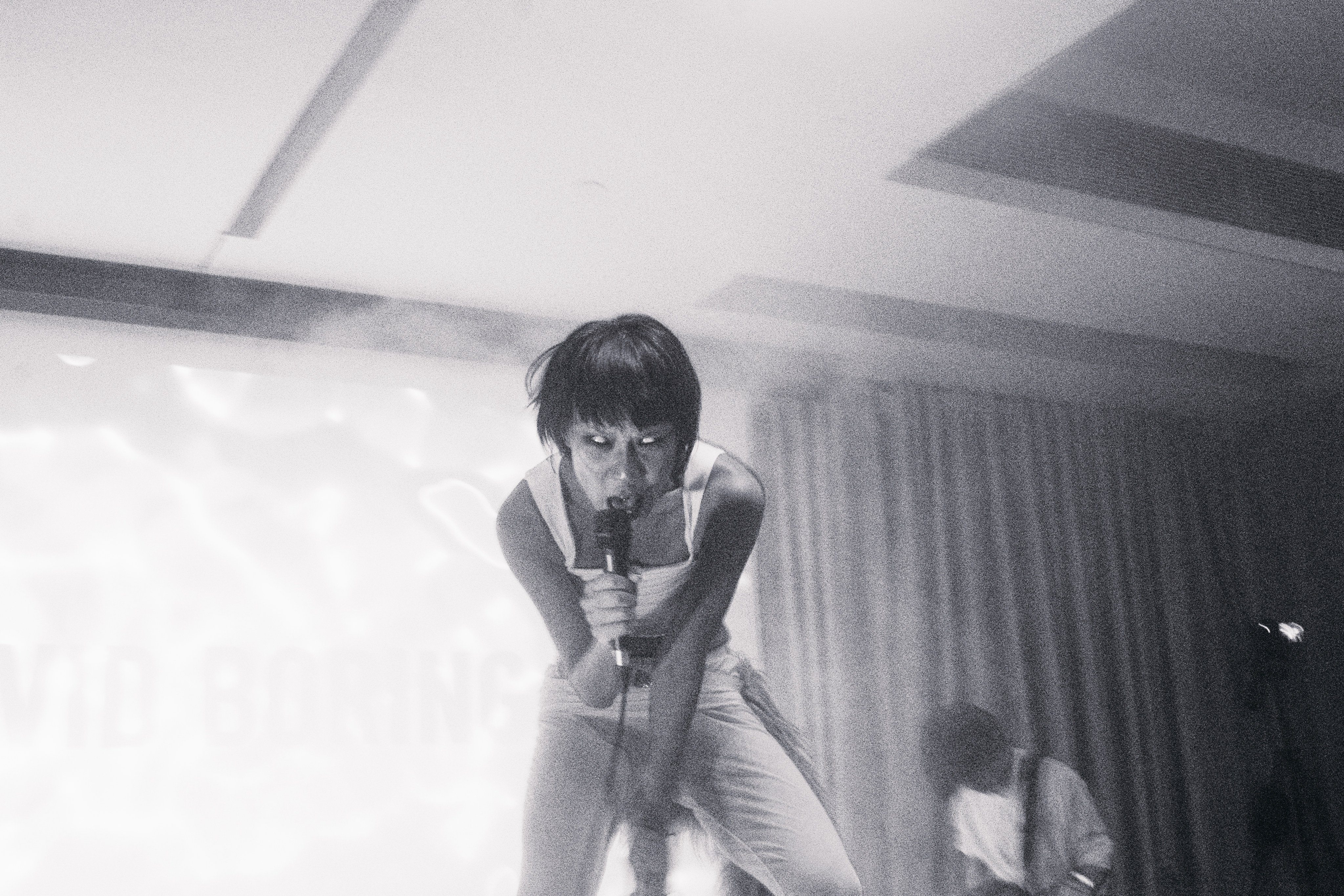 Janice Lau of David Boring performs at Current Plans in Wong Chuk Hang, Hong Kong, on March 15, 2025. The one-off show, titled “Stare Out From Your Own Burning”, included the band live-scoring horror music videos by local filmmakers with new songs. Photo: Elton Fung