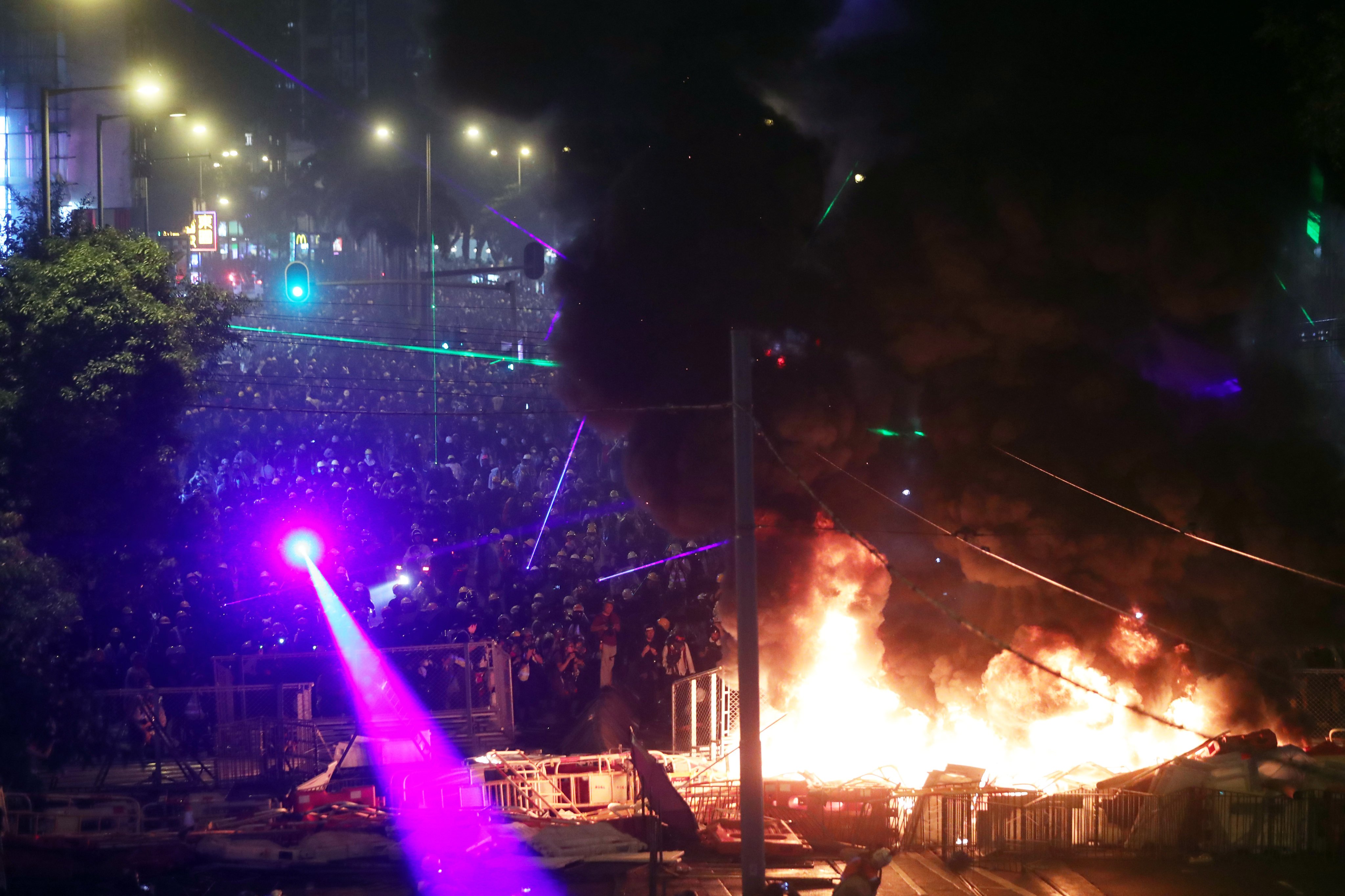 Protesters set fire to a makeshift barricade, hurled petrol bombs and used laser beams on police during a riot on Hennessy Road, Wan Chai, the court heard. Photo: Sam Tsang