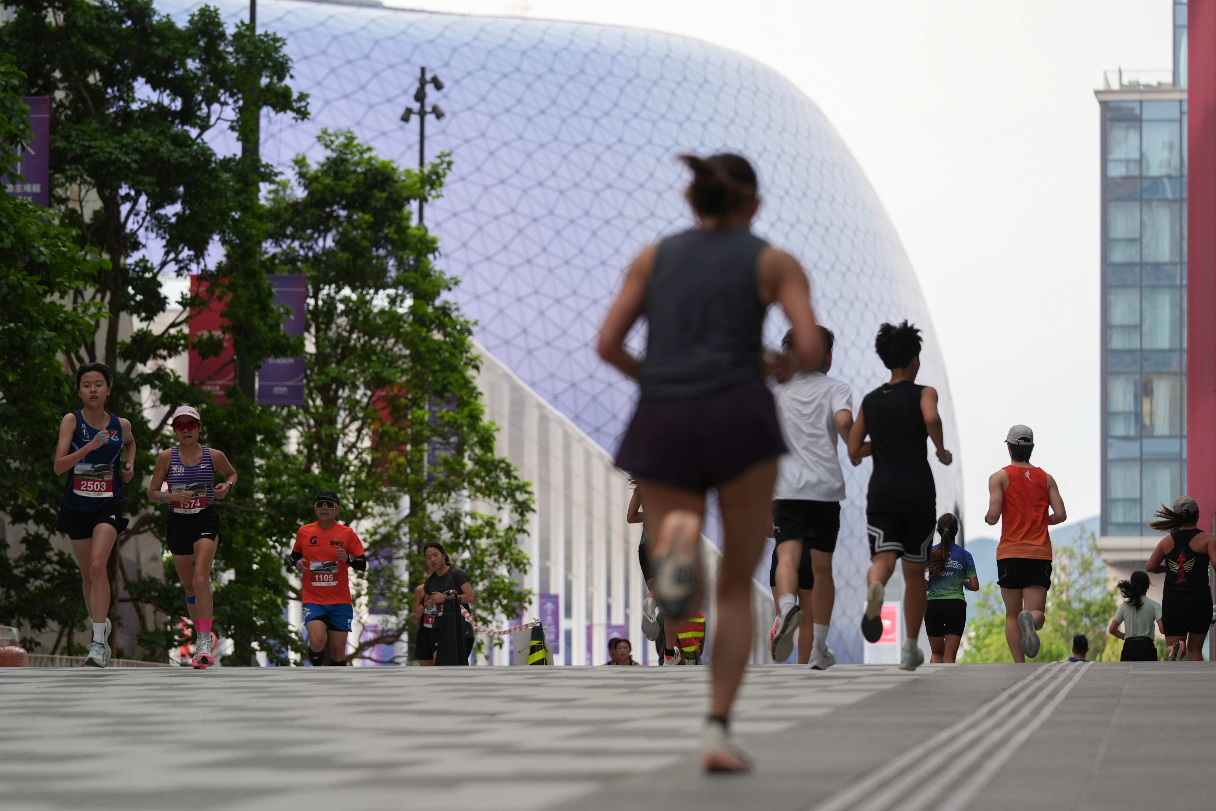 Runners take part in the “Kai Tak Flying Run”, the first running event at Kai Tak Sports Park, on March 16. Photo: Eugene Lee