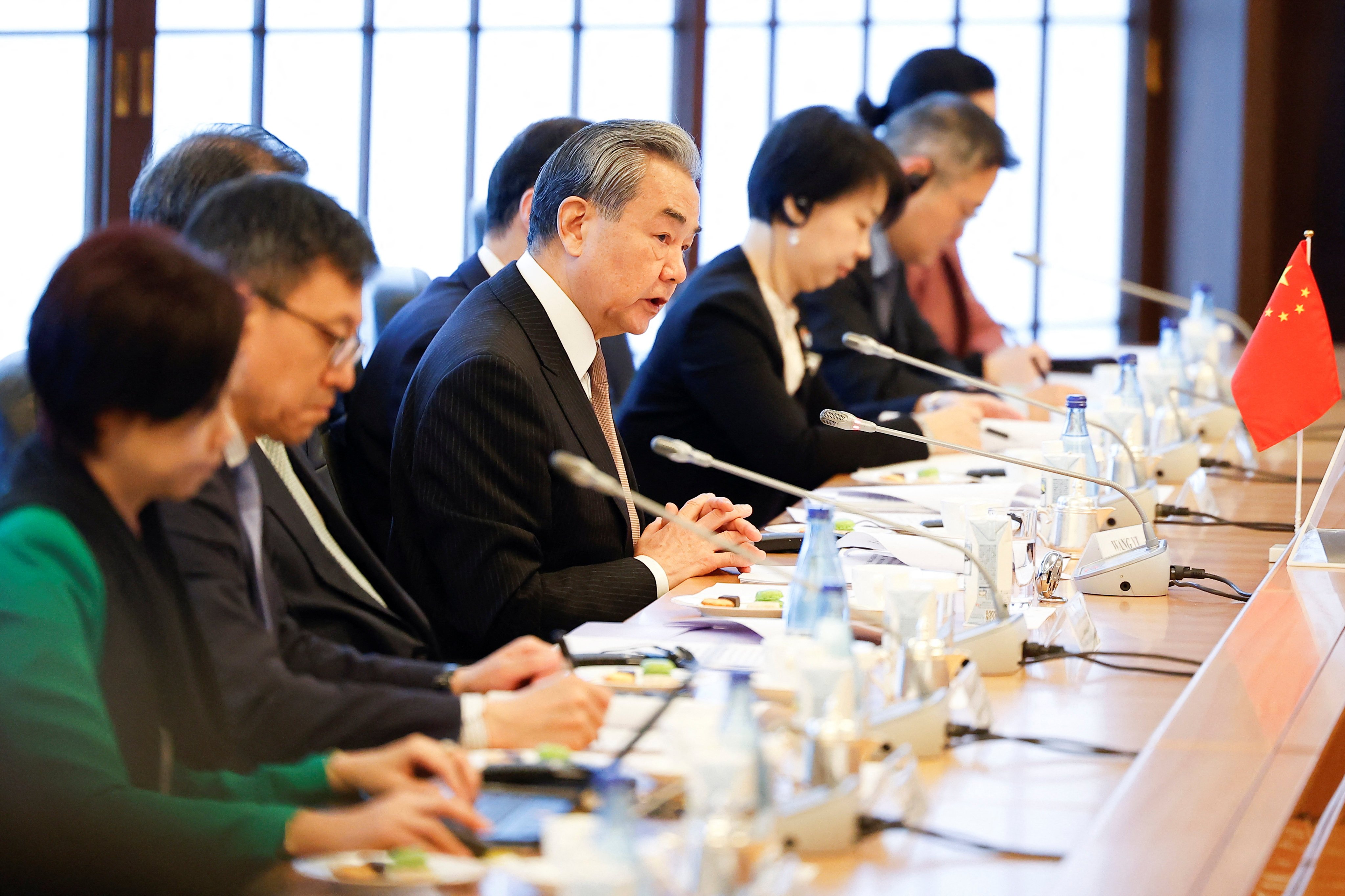 Chinese Foreign Minister Wang Yi addresses a meeting with his Japanese and South Korean counterparts in Tokyo on Saturday. Photo: Reuters