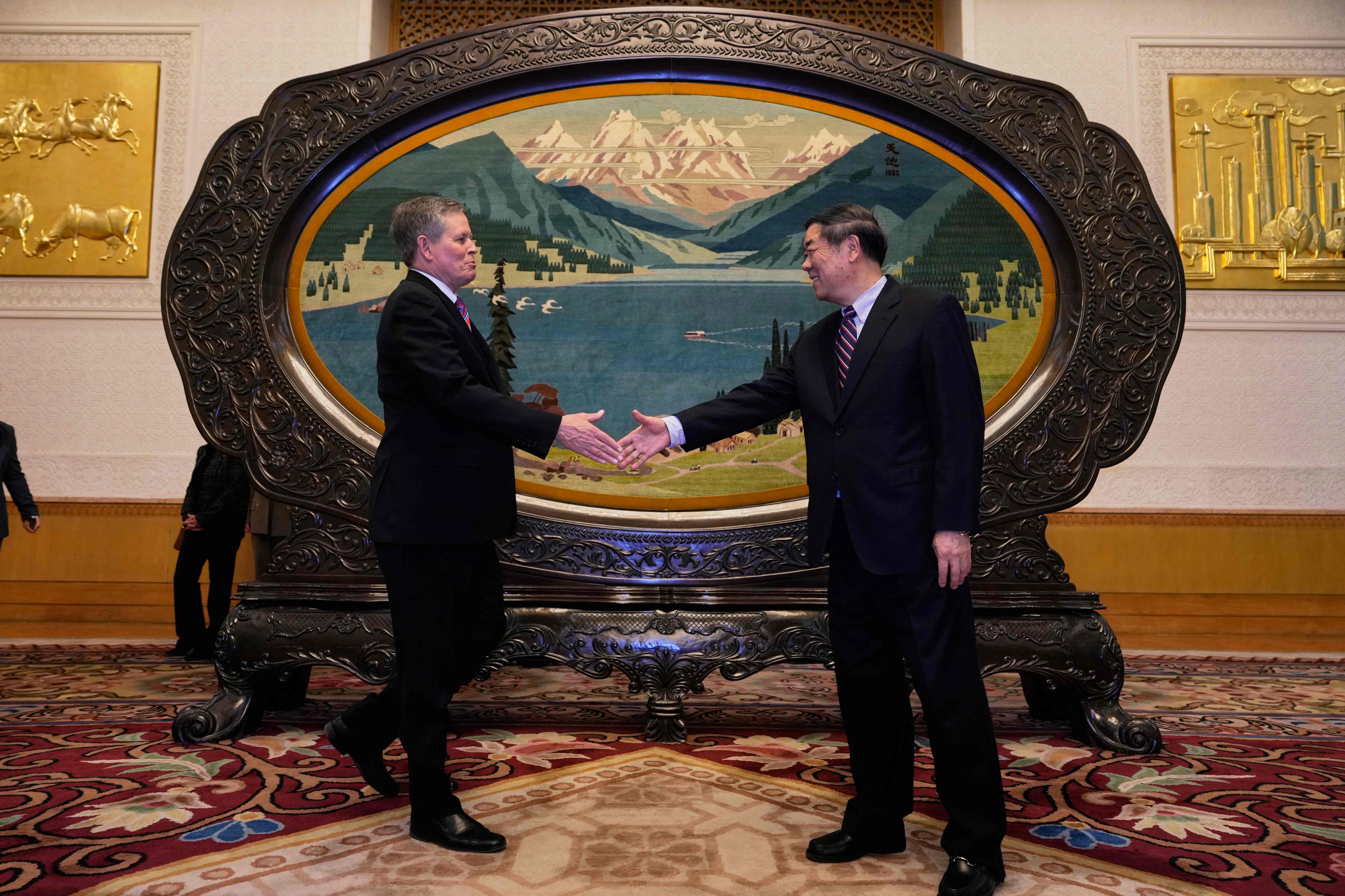 Chinese Vice-Premier He Lifeng greets US Senator Steve Daines ahead of their meeting at the Great Hall of the People, in Beijing on March 22. Photo: AFP