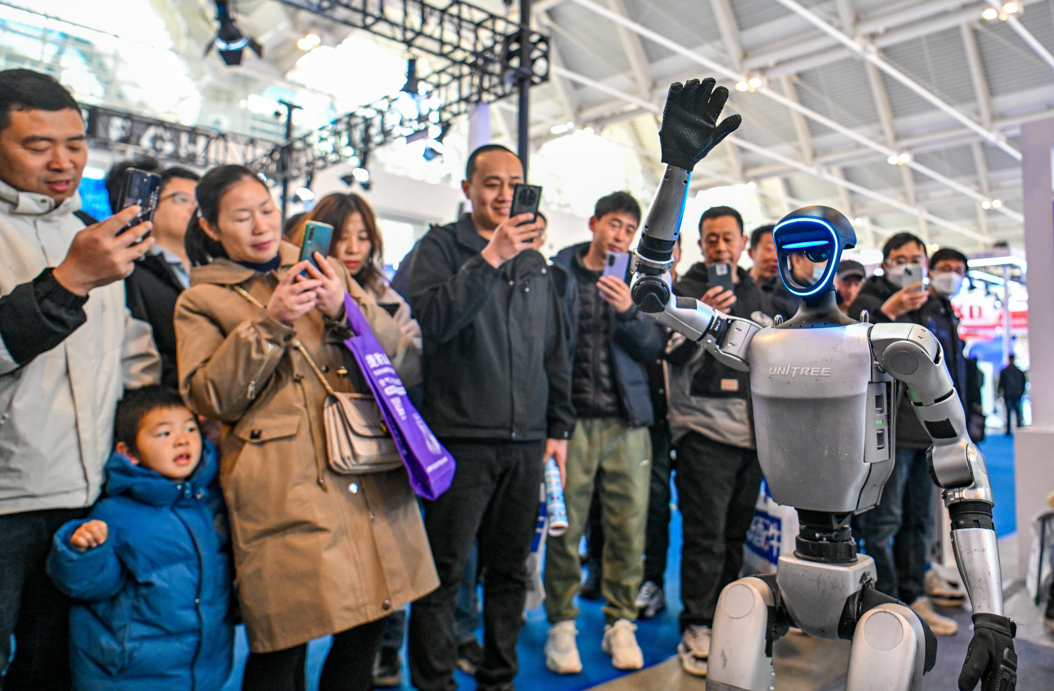 A robot performs during a trade show in Tianjin, China on March 6. Beijing has pledged to raise funding for artificial intelligence as part of an action plan to boost consumption. Photo: Xinhua