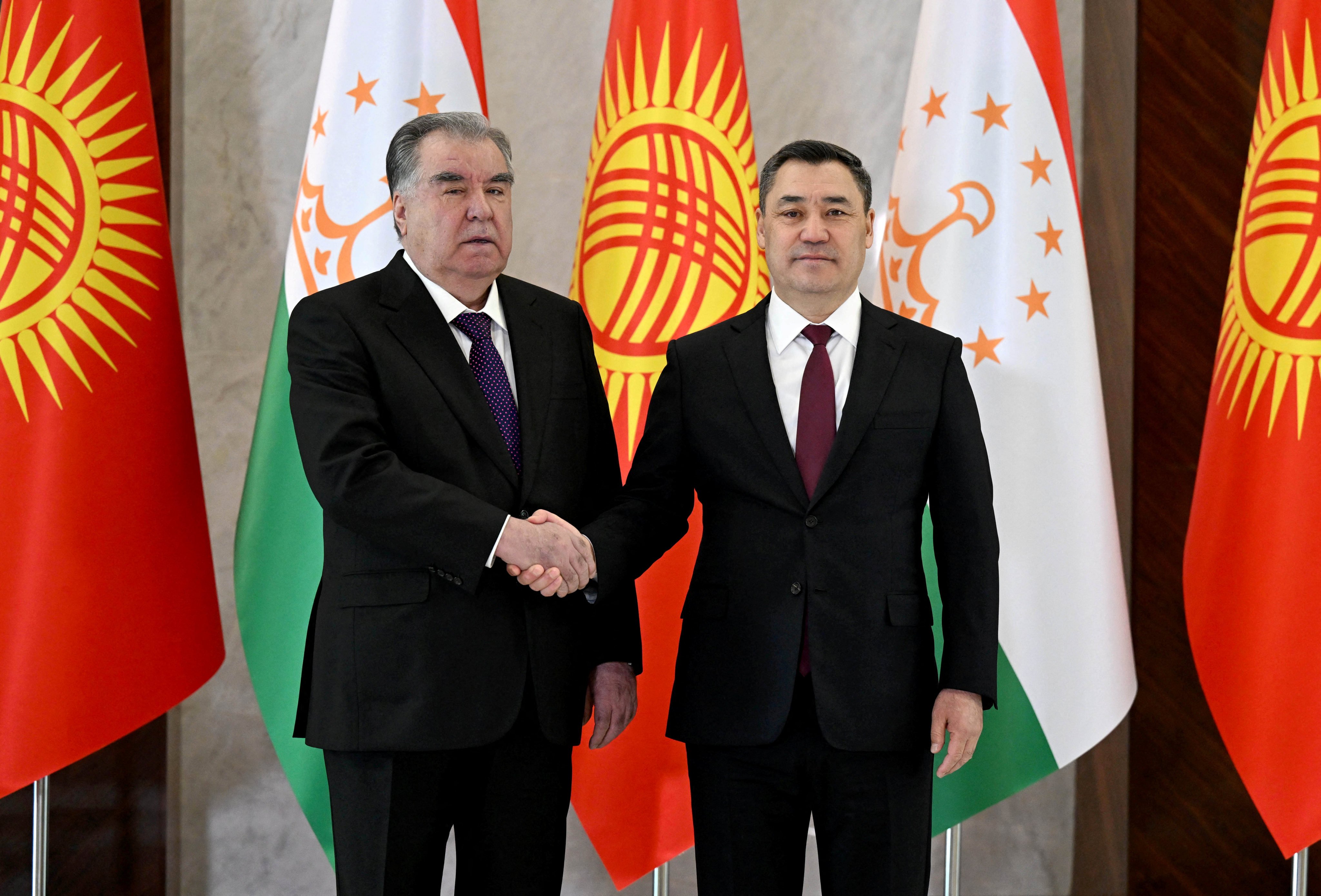 Kyrgyzstan President Sadyr Japarov (right) shakes hands with his Tajik counterpart Emomali Rahmon at Bishkek on March 13. Photo: Reuters/Kyrgyz Presidential Press Service