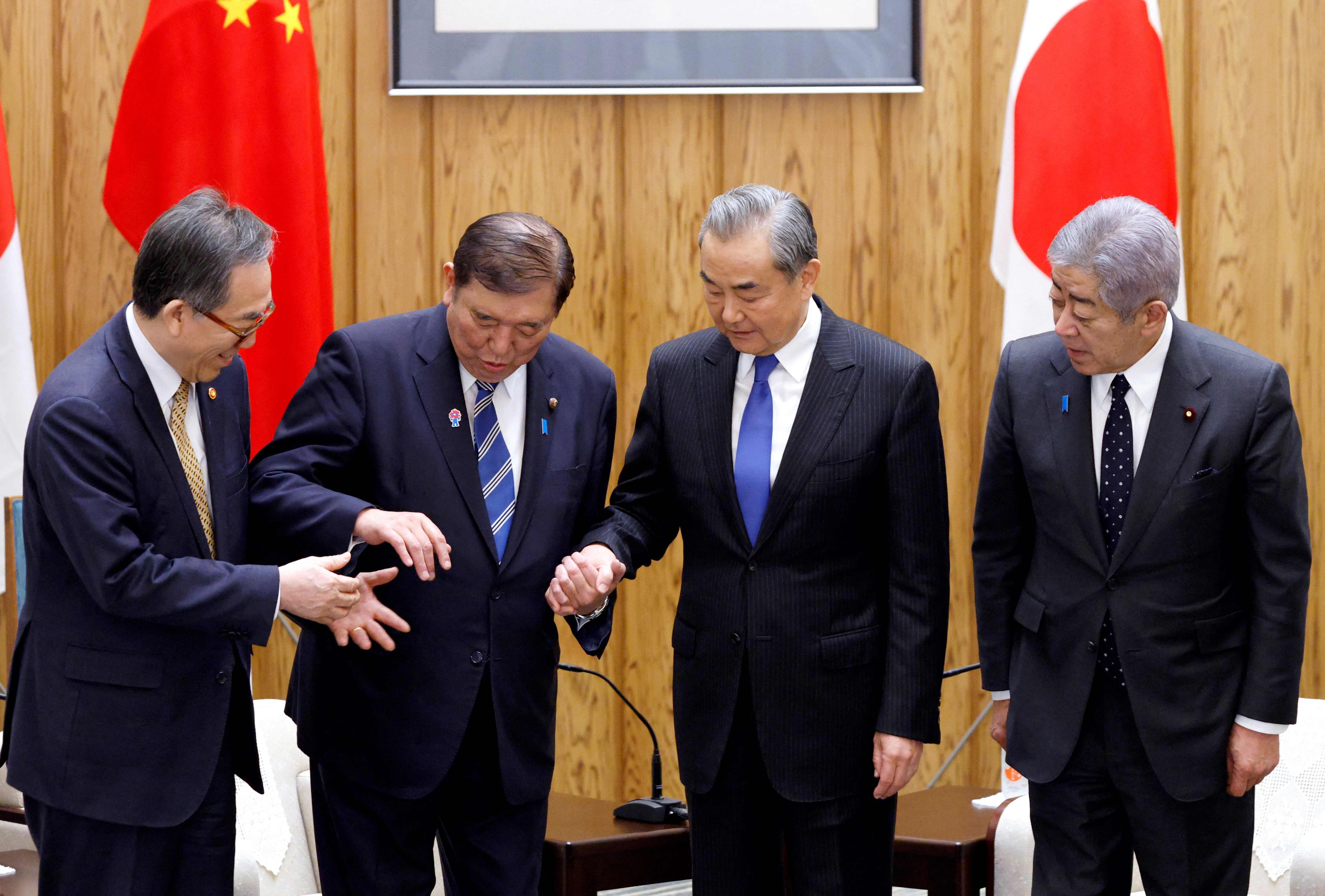 Japanese Prime Minister Shigeru Ishiba (second left) with (from left) foreign ministers Cho Tae-yul of South Korea,  Wang Yi of China and Japan’s Takeshi Iwaya, ahead of their meeting at the prime minister’s official residence, in Tokyo on March 21. Photo: AFP