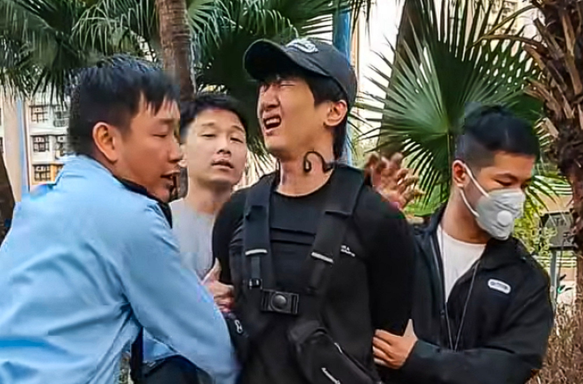 Police officers handcuff ex-singer Roy Chow after he is caught illegally using an electric unicycle in Tin Shui Wai. Photo: Facebook/Ho Simon Police officers handcuff ex-singer Roy Chow after he is caught illegally using an electric unicycle in Tin Shui Wai. Photo: Facebook/Ho Simon