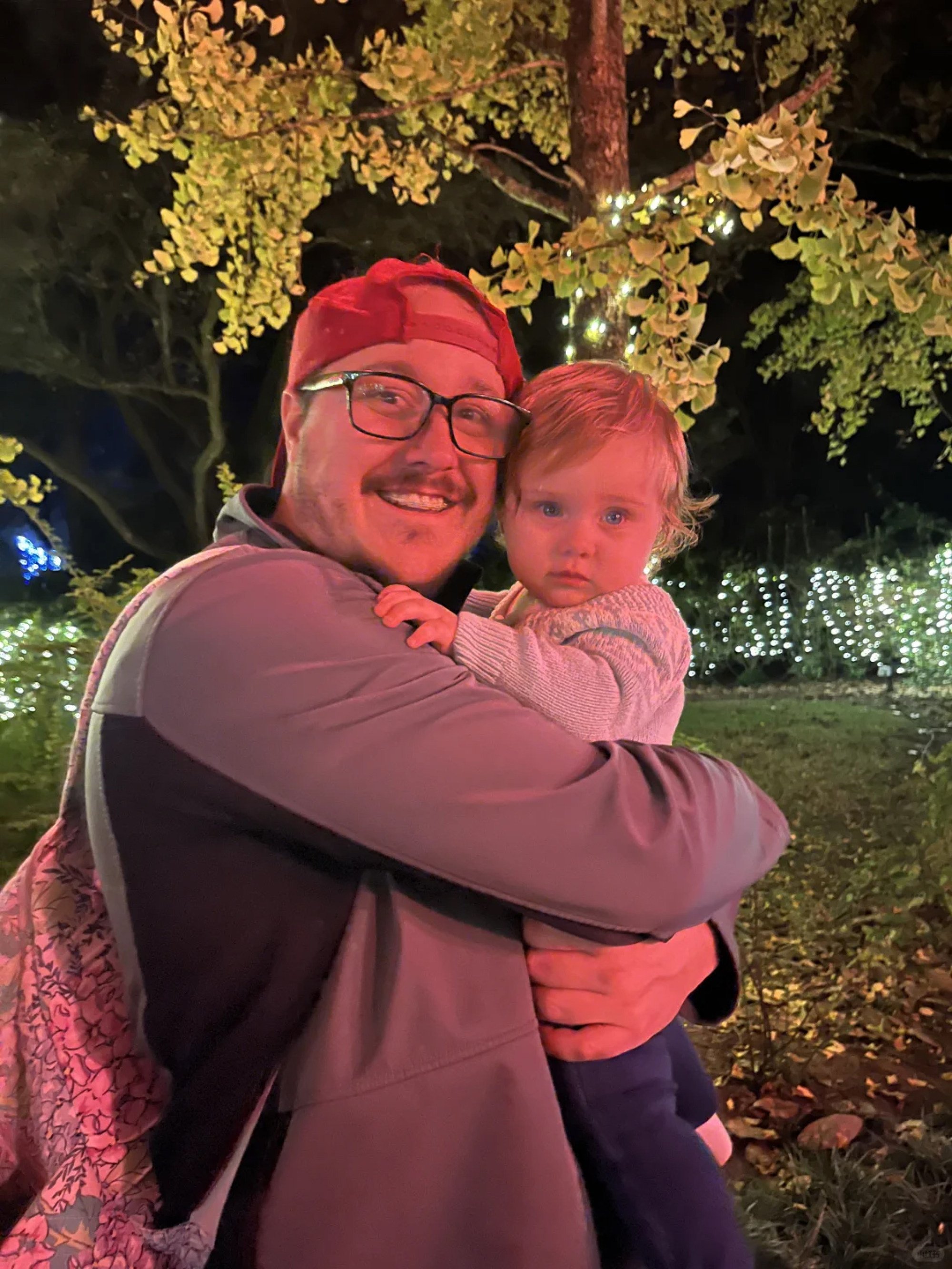 Real-estate agent Brecken Neumann with his baby daughter Meredith. Photo: RedNote