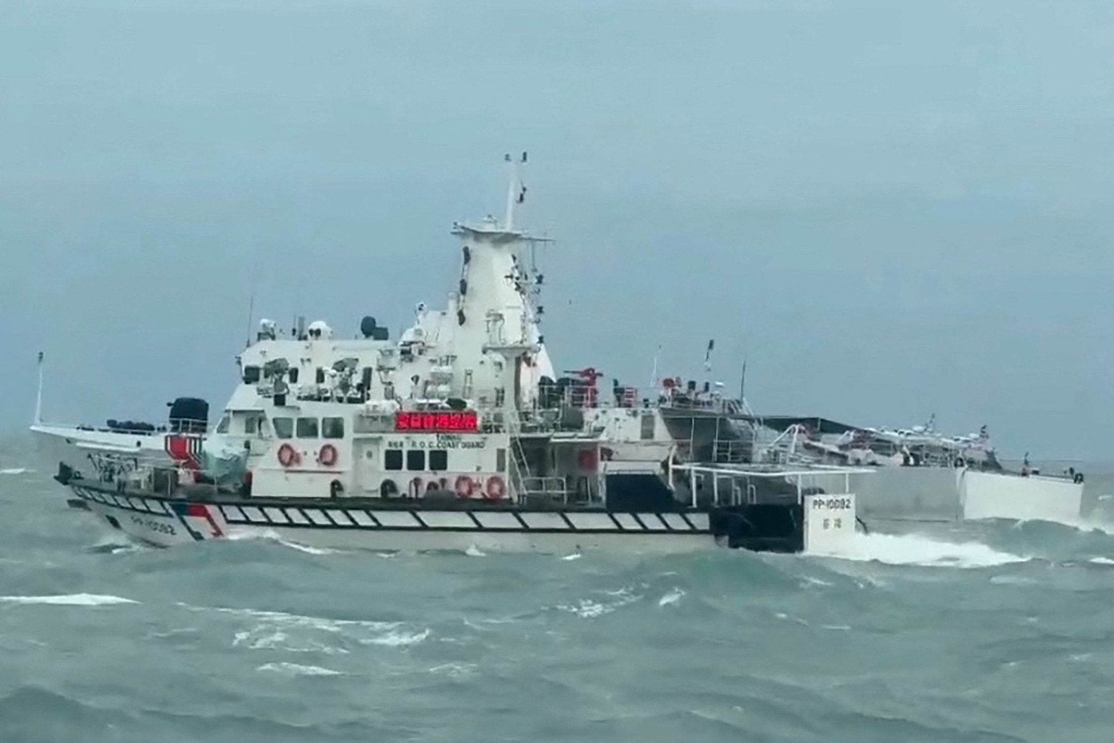 Taiwan coastguard ship (front) and a Chinese coastguard ship (back) off the Matsu Islands in Taiwan on April 1, 2025. Photo: handout by Taiwan Coast Guard
