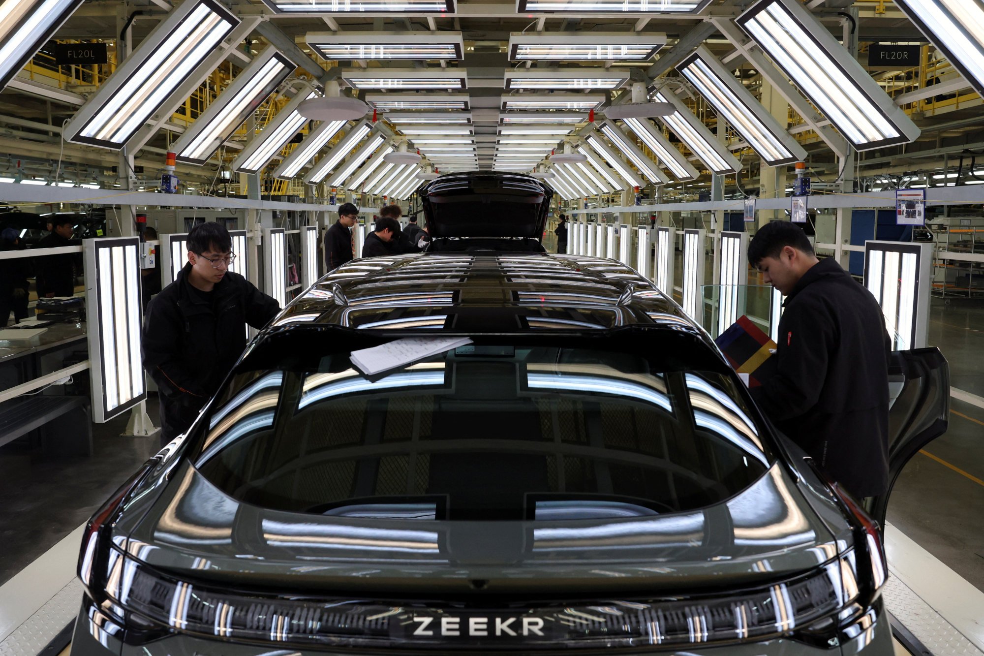 Employees work on a production line at a Zeekr factory in Cixi, Zhejiang province on March 19, 2025. Photo: Reuters