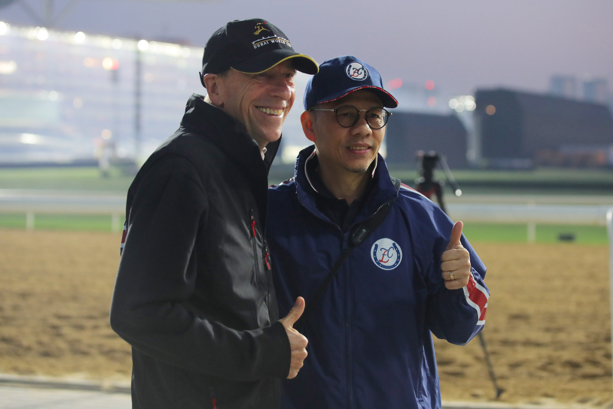 Trainers John Size (left) and Frankie Lor pose for photos at Meydan on Friday morning.
