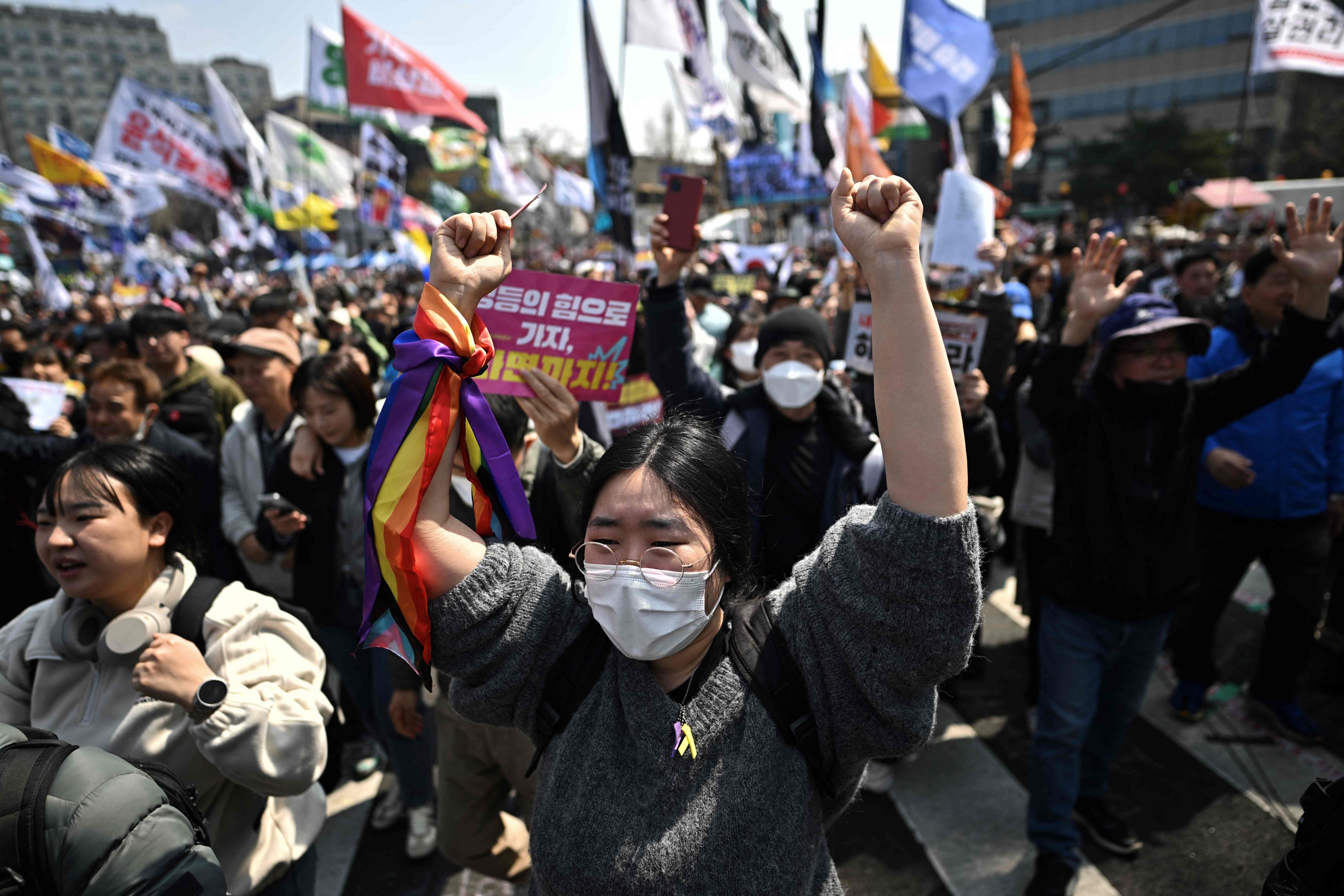 South Koreans celebrate after Yoon Suk-yeol was removed from office on Friday. Photo: AFP