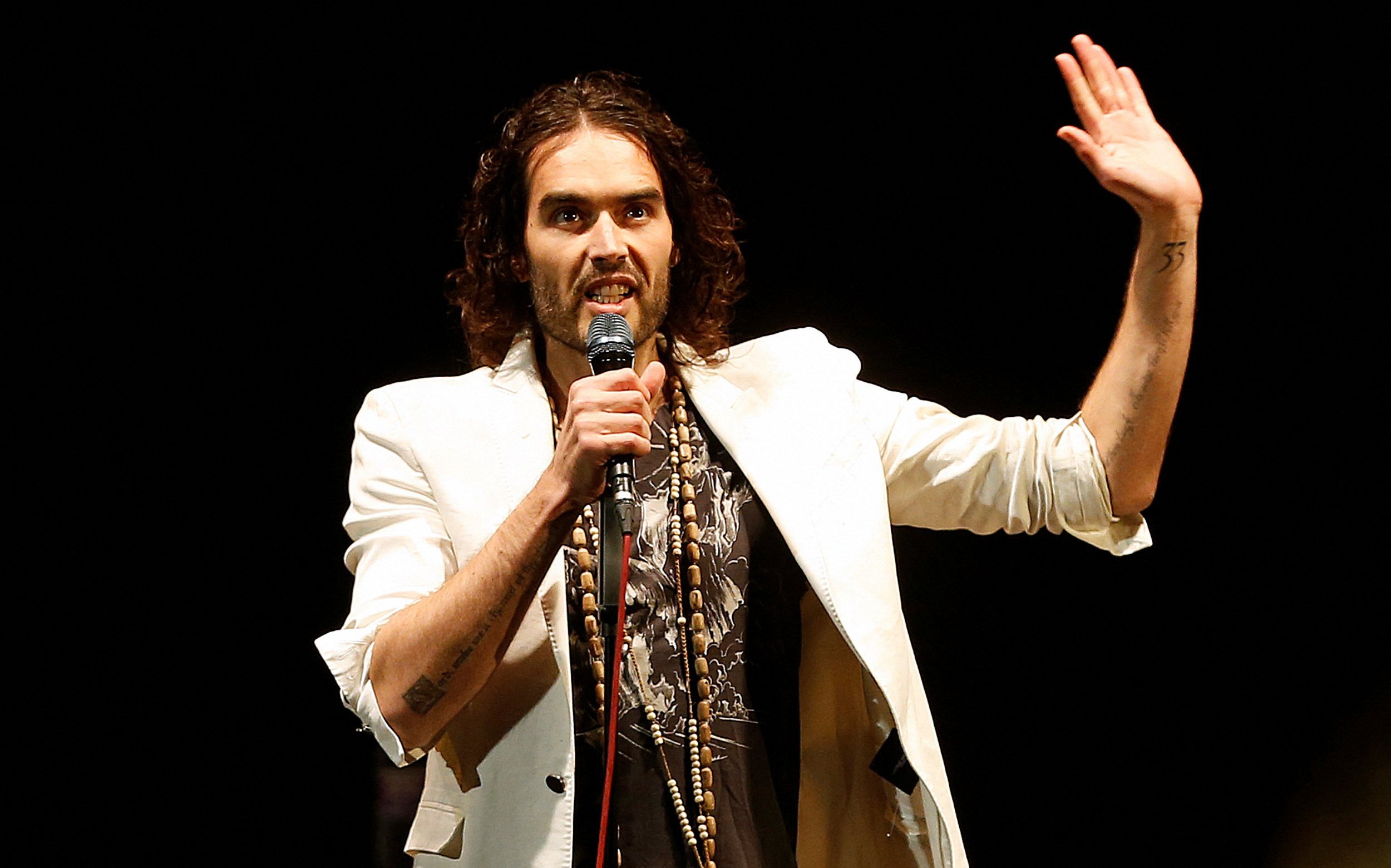British comedian Russell Brand, 50, faces one count of rape, one of indecent assault, one of oral rape and two of sexual assault. Photo: Reuters