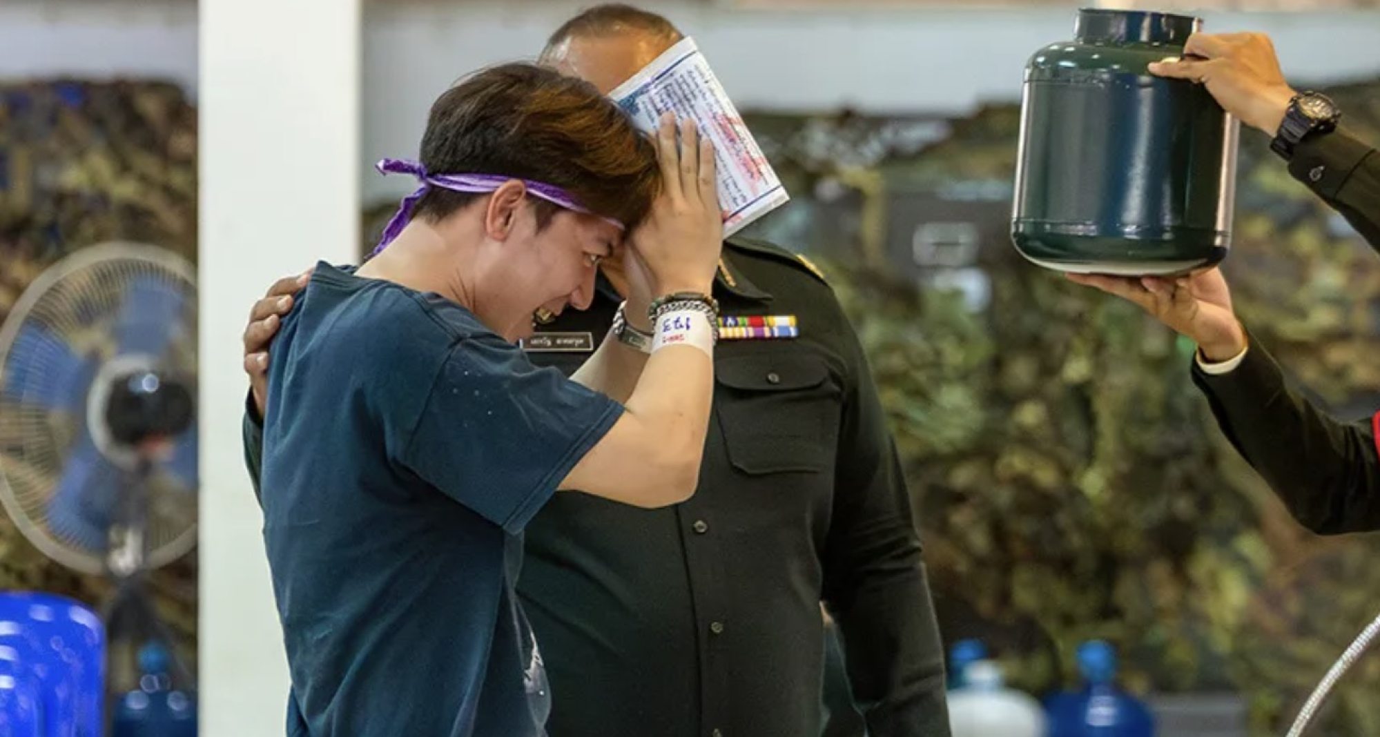 A person prays for luck while smiling at a military conscription lottery exercise. Photo: Weixin A person prays for luck while smiling at a military conscription lottery exercise. Photo: Weixin