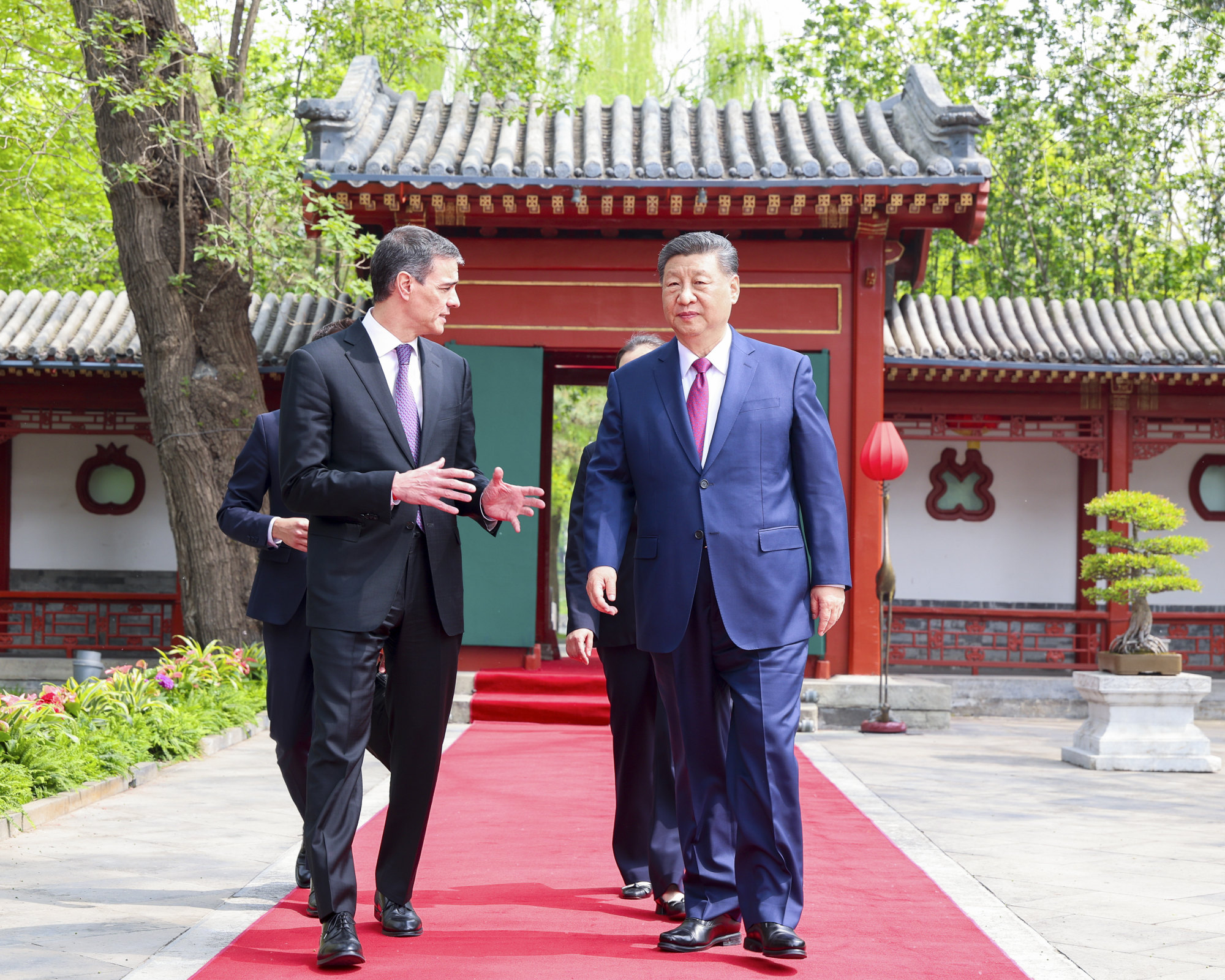 Spanish Prime Minister Pedro Sanchez walks with Chinese President Xi Jinping outside the Diaoyutai State Guesthouse in Beijing on Friday. Sanchez has visited China three times in three years. Photo: Xinhua