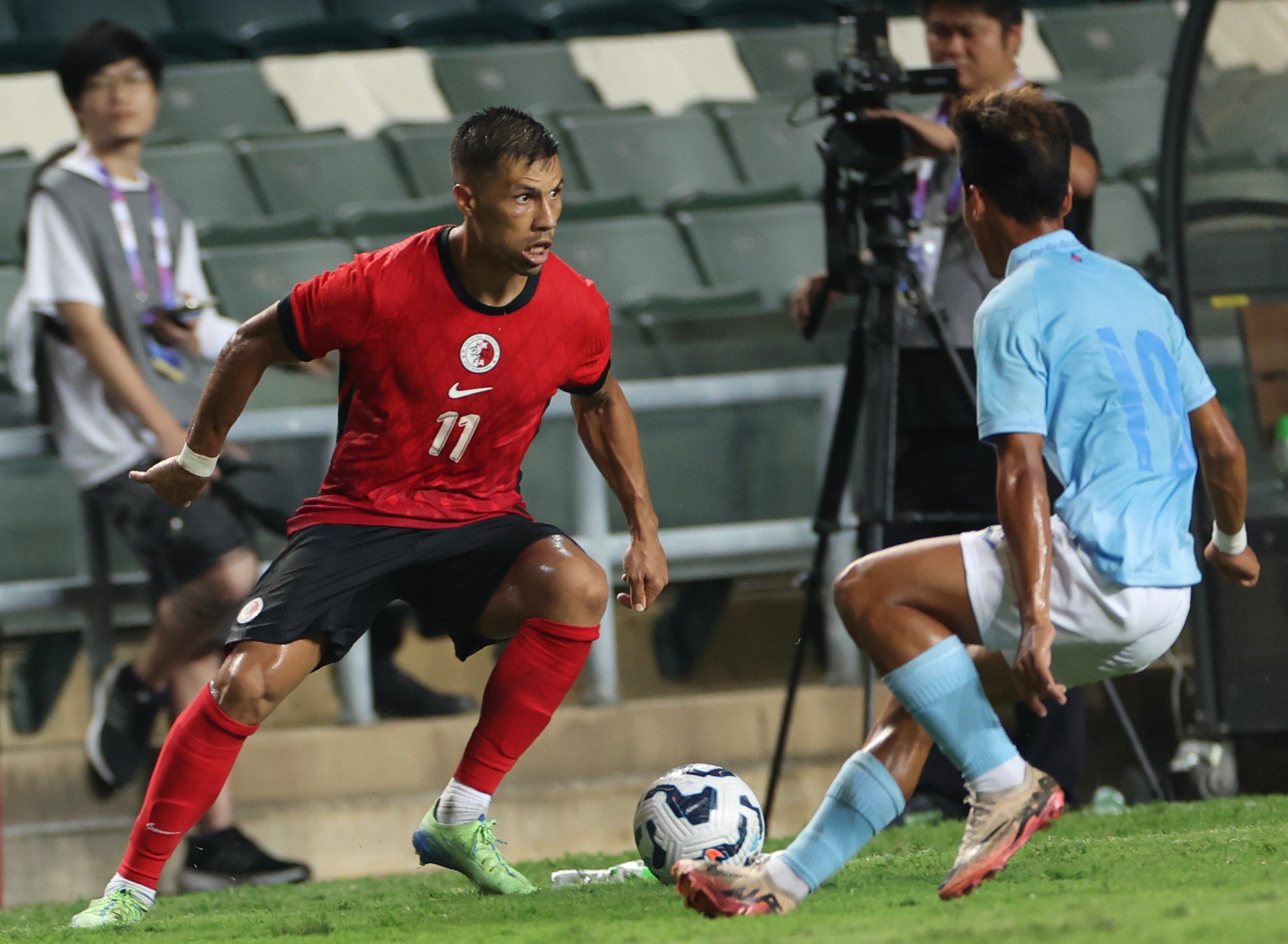 Juninho (left) eyes an attacking opportunity during Hong Kong’s 3-0 victory over Cambodia last October. Photo: Dickson Lee