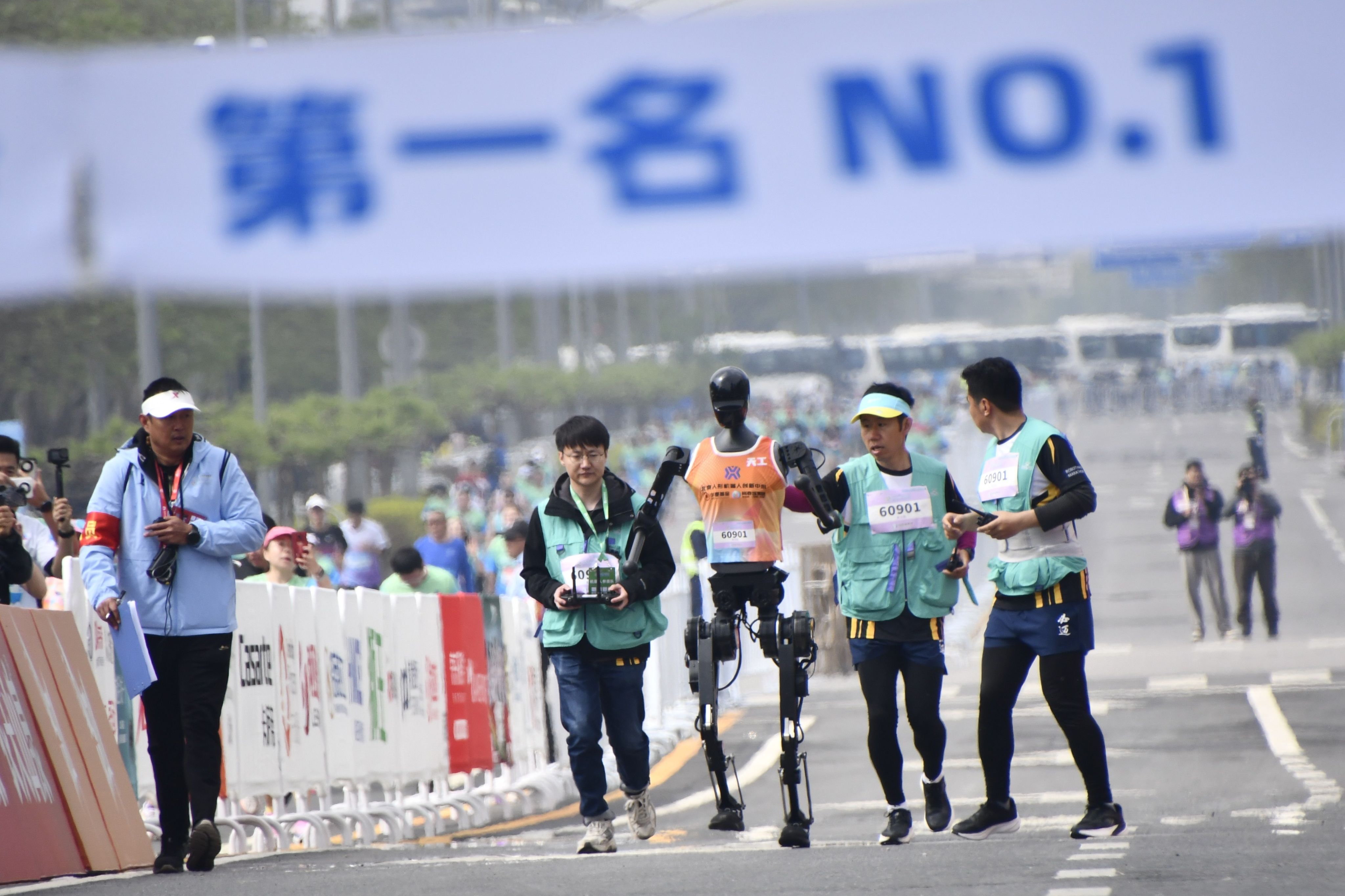 Humanoid robots joined thousands in a Beijing half-marathon, showcasing AI and robotics innovation. Photo: Xinhua