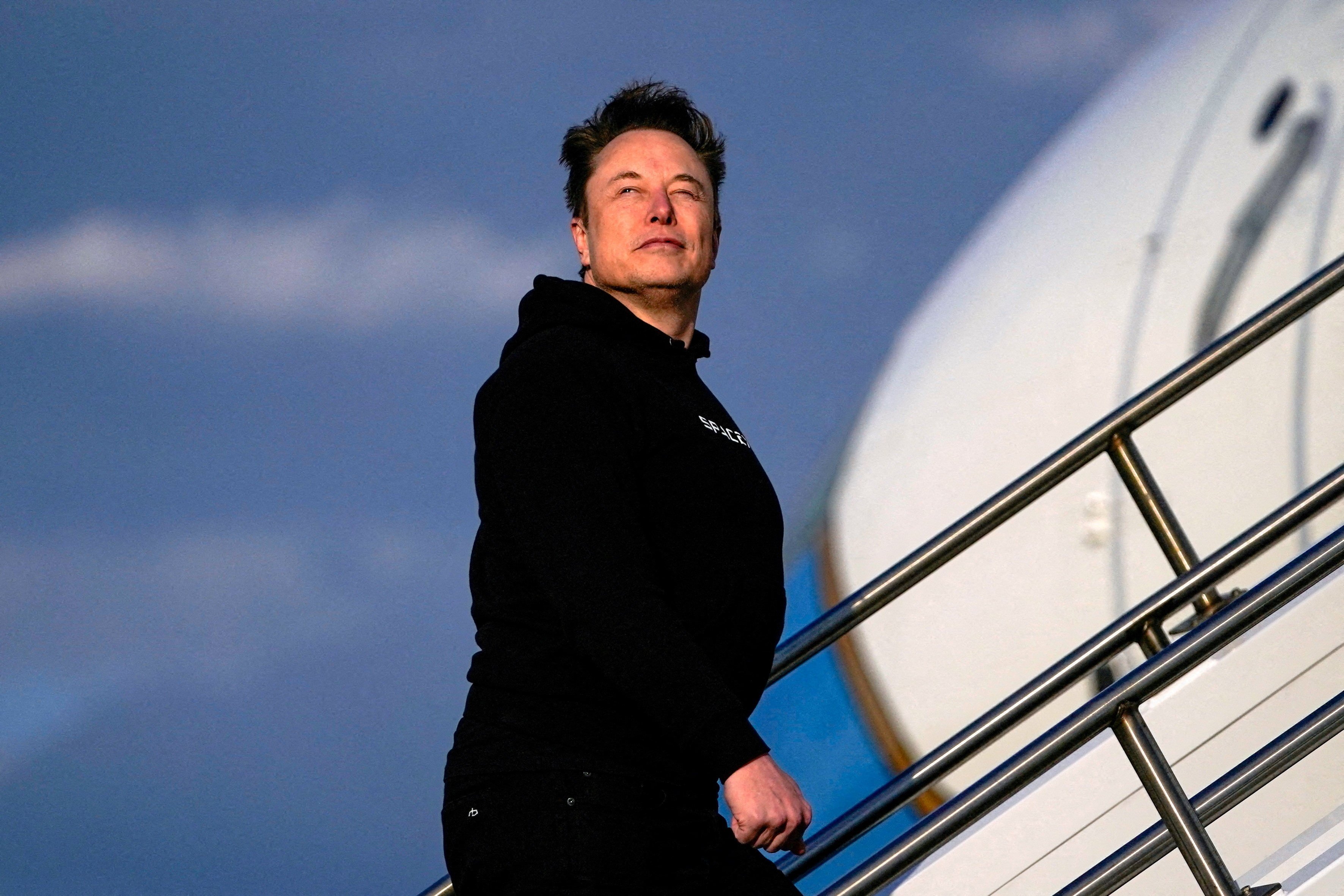 Elon Musk boards Air Force One in New Jersey on March 22. Photo: Reuters