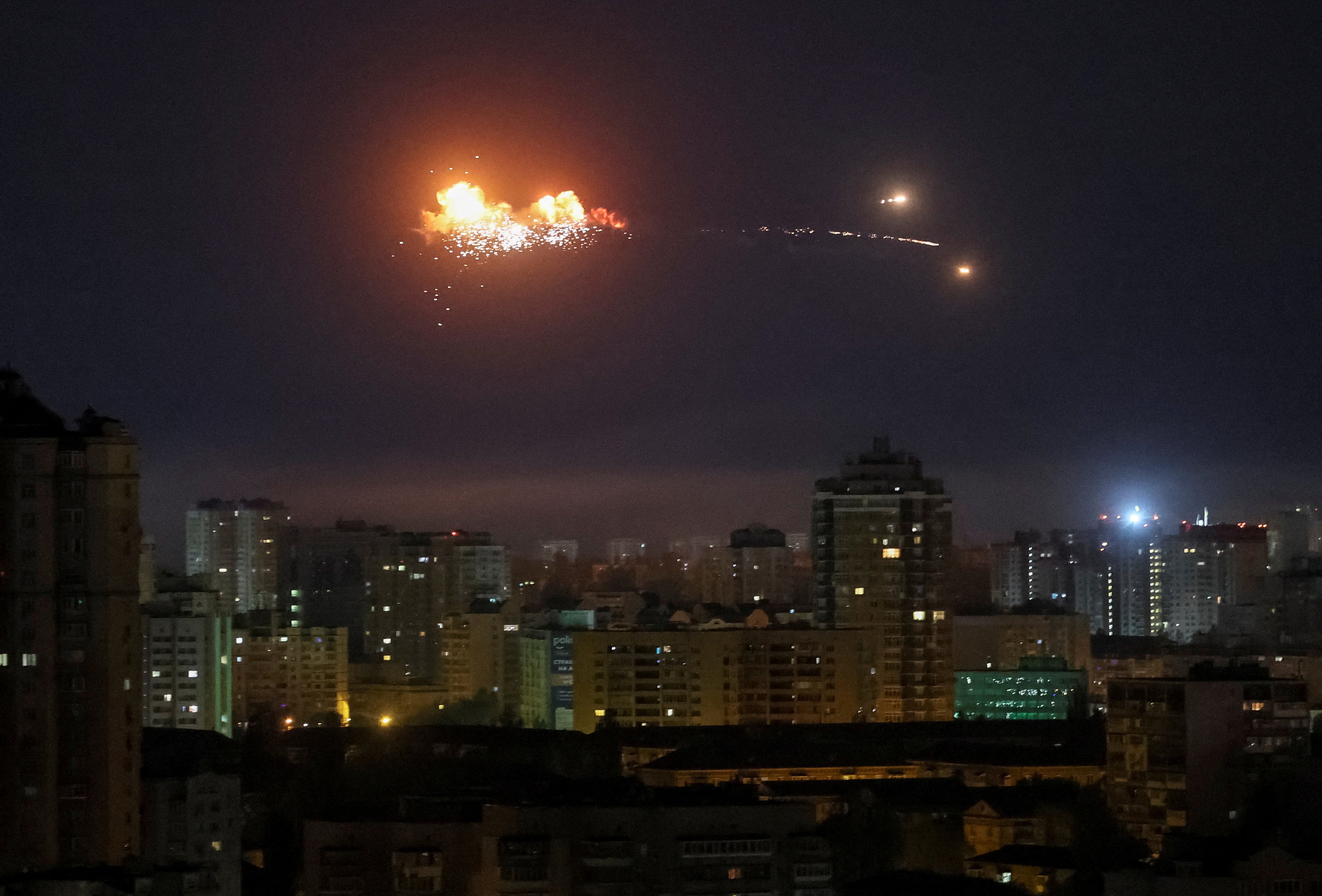 A Russian ballistic missile explodes in the sky over the city in Kyiv on Thursday. Photo: Reuters
