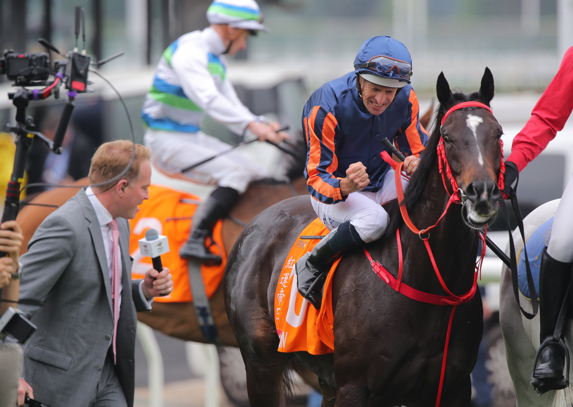 Hugh Bowman punches the air after the Champions Mile result is announced. Hugh Bowman punches the air after the Champions Mile result is announced.