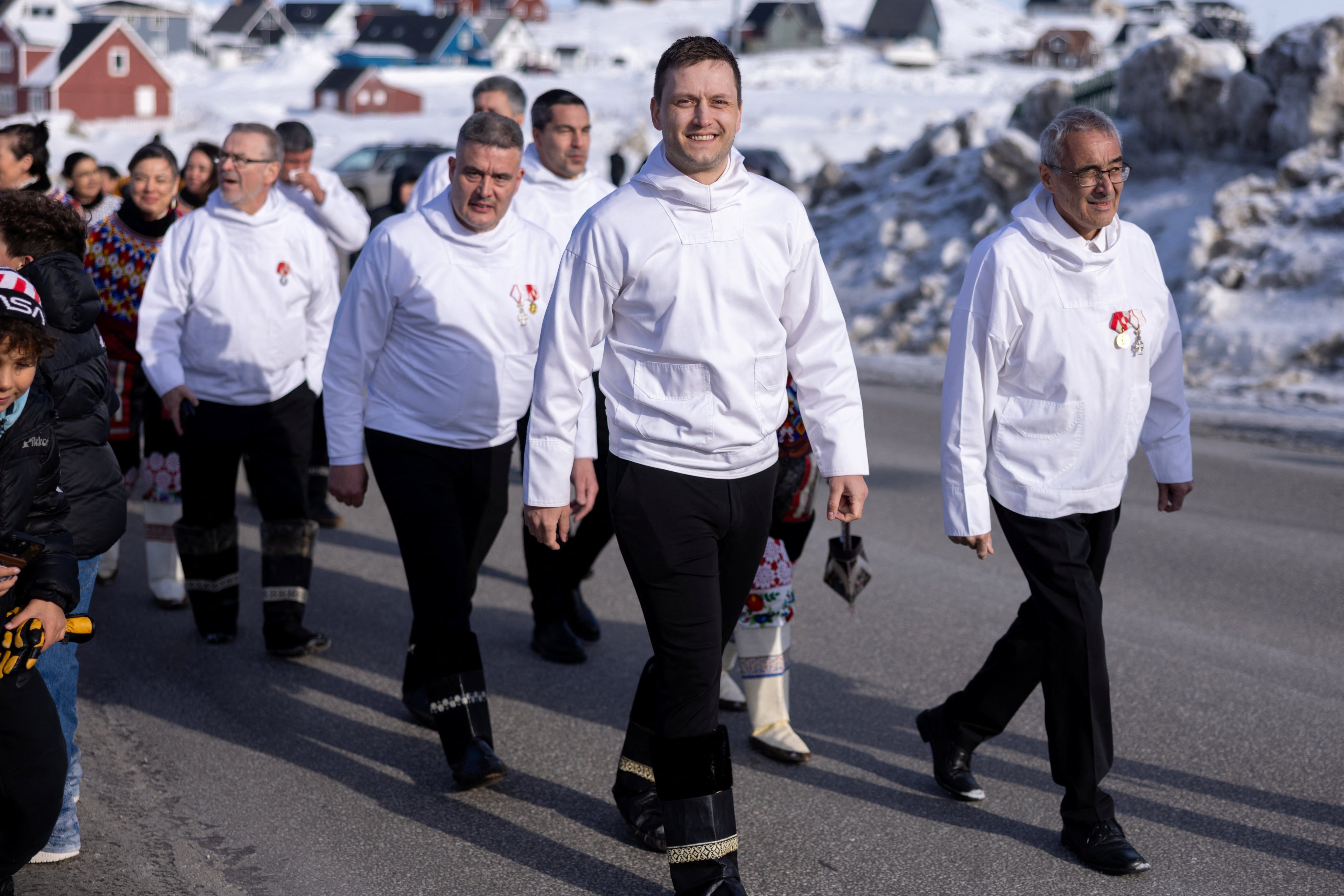 Greenland’s Prime Minister Jens-Frederik Nielsen (centre) in the procession from Hans Egede house to Nuuk Cathedral, where a service was to be held during the constitutive meeting of the newly elected parliament, in Nuuk, Greenland, on April 7. Photo: Reuters